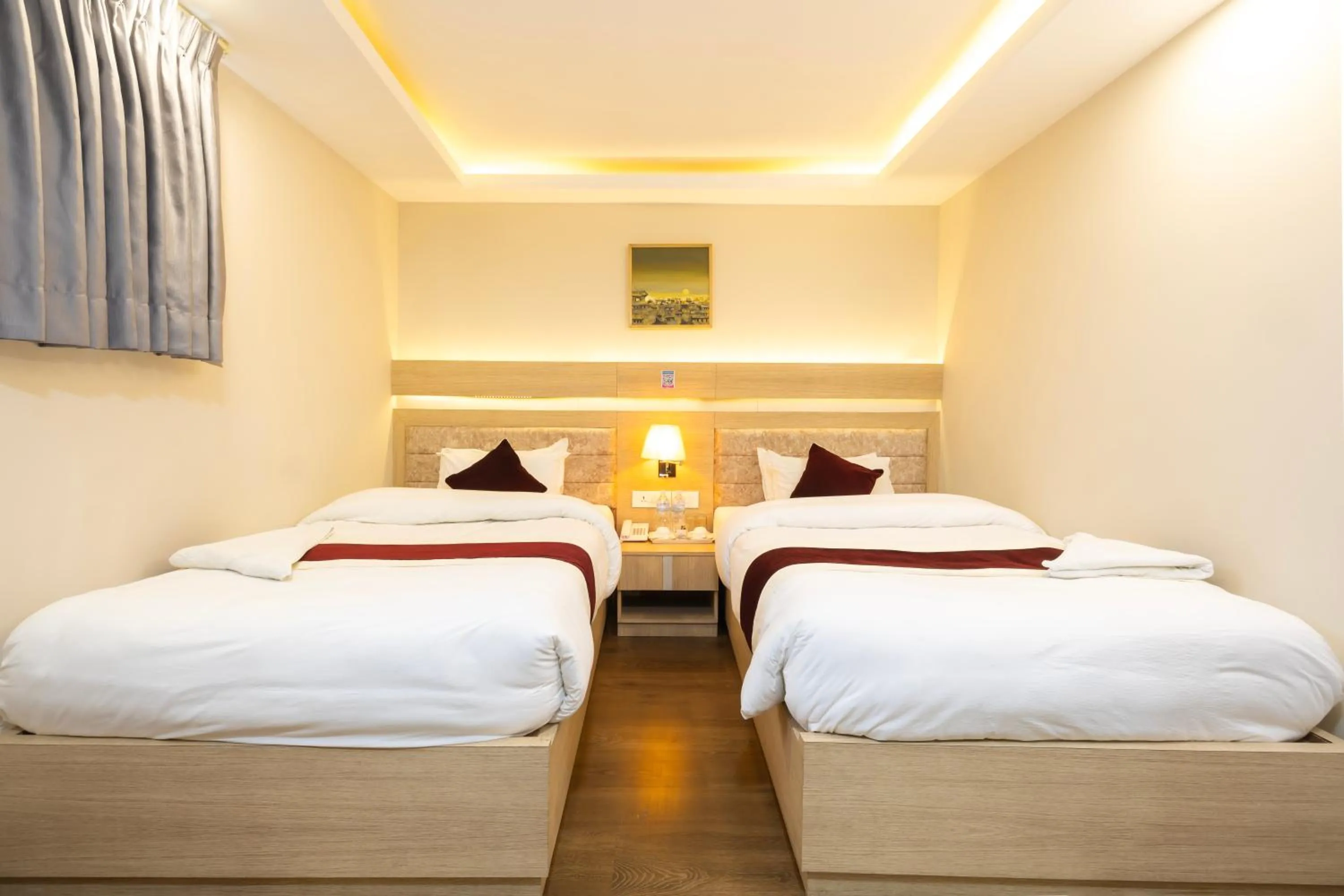 Bed in Divine Kathmandu Hotel