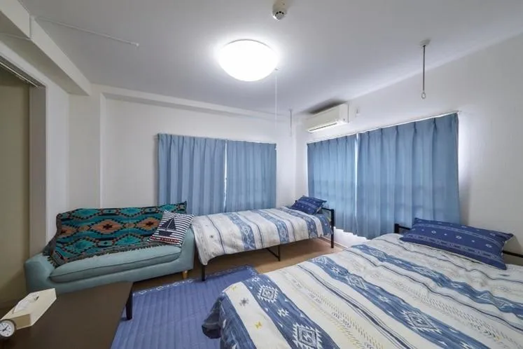 Bed in Oyado Kinokuniya Daikokumachi