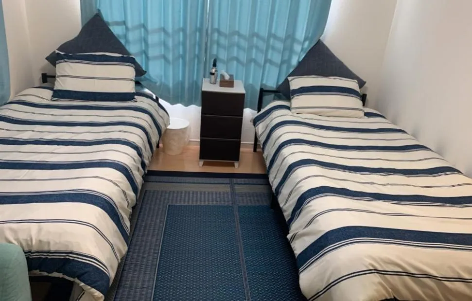 Bed in Oyado Kinokuniya Daikokumachi