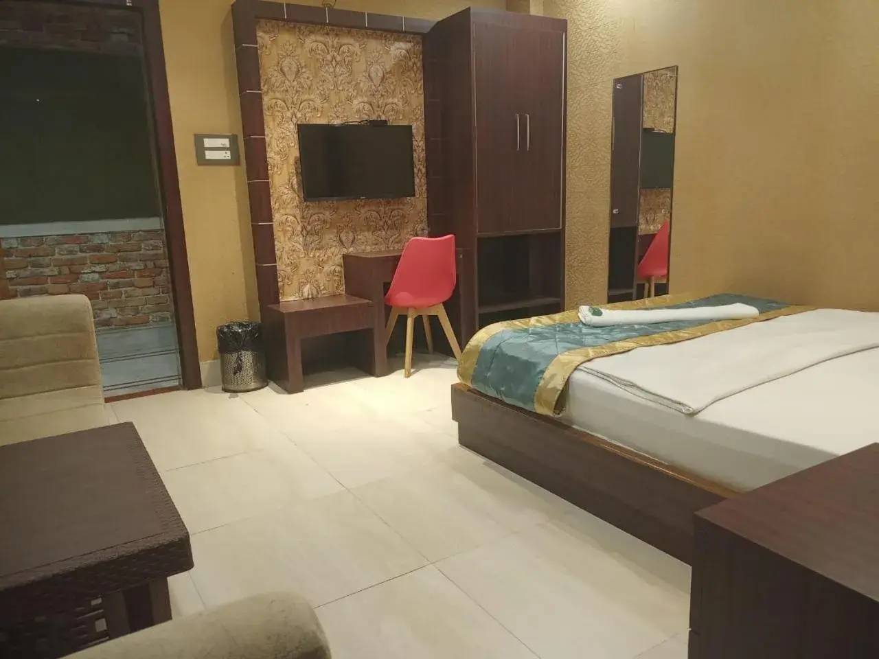 Bed in The Brahmaputra Hotel Bed in The Brahmaputra Hotel