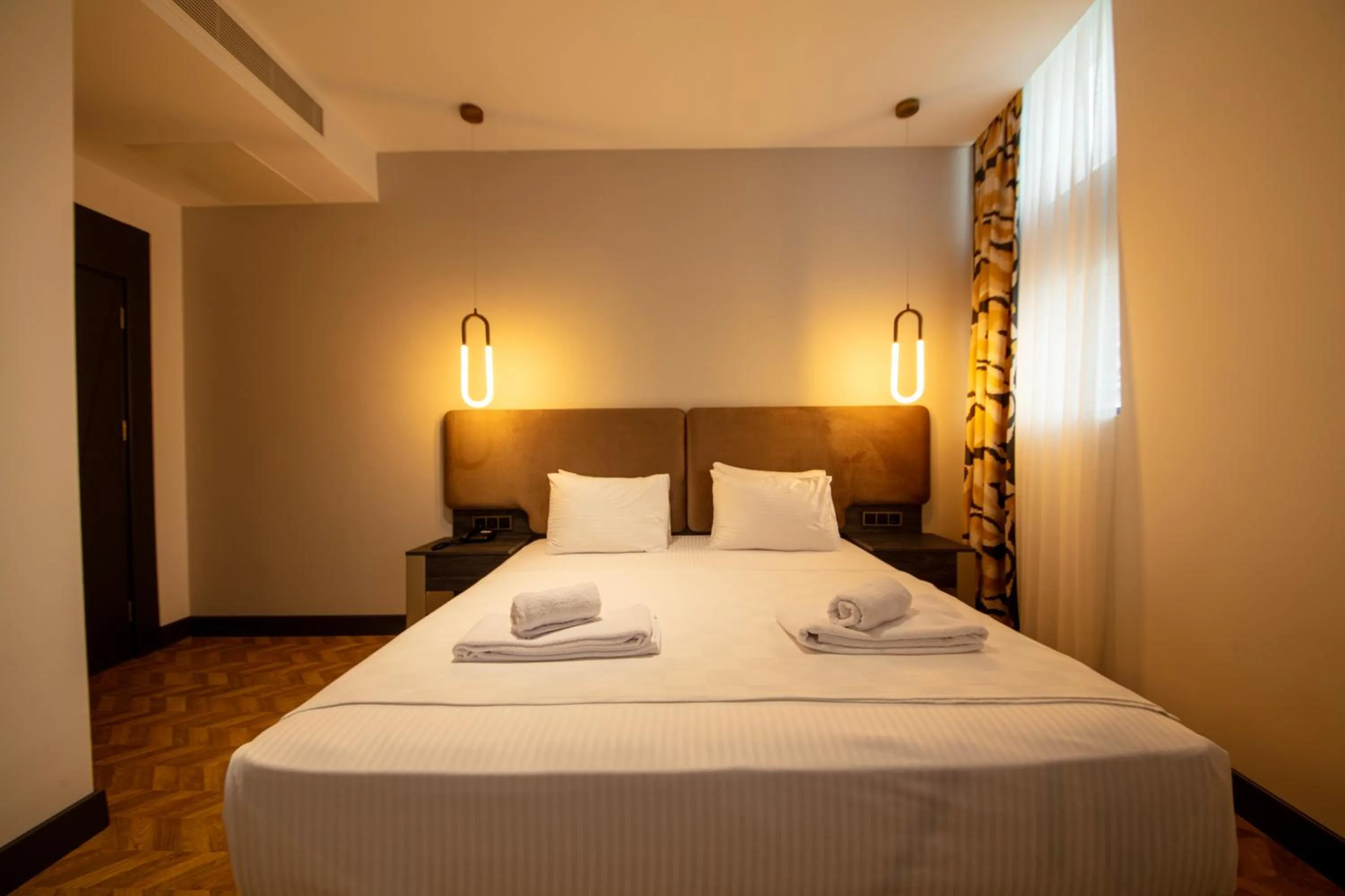 Bed in V Center Hotel