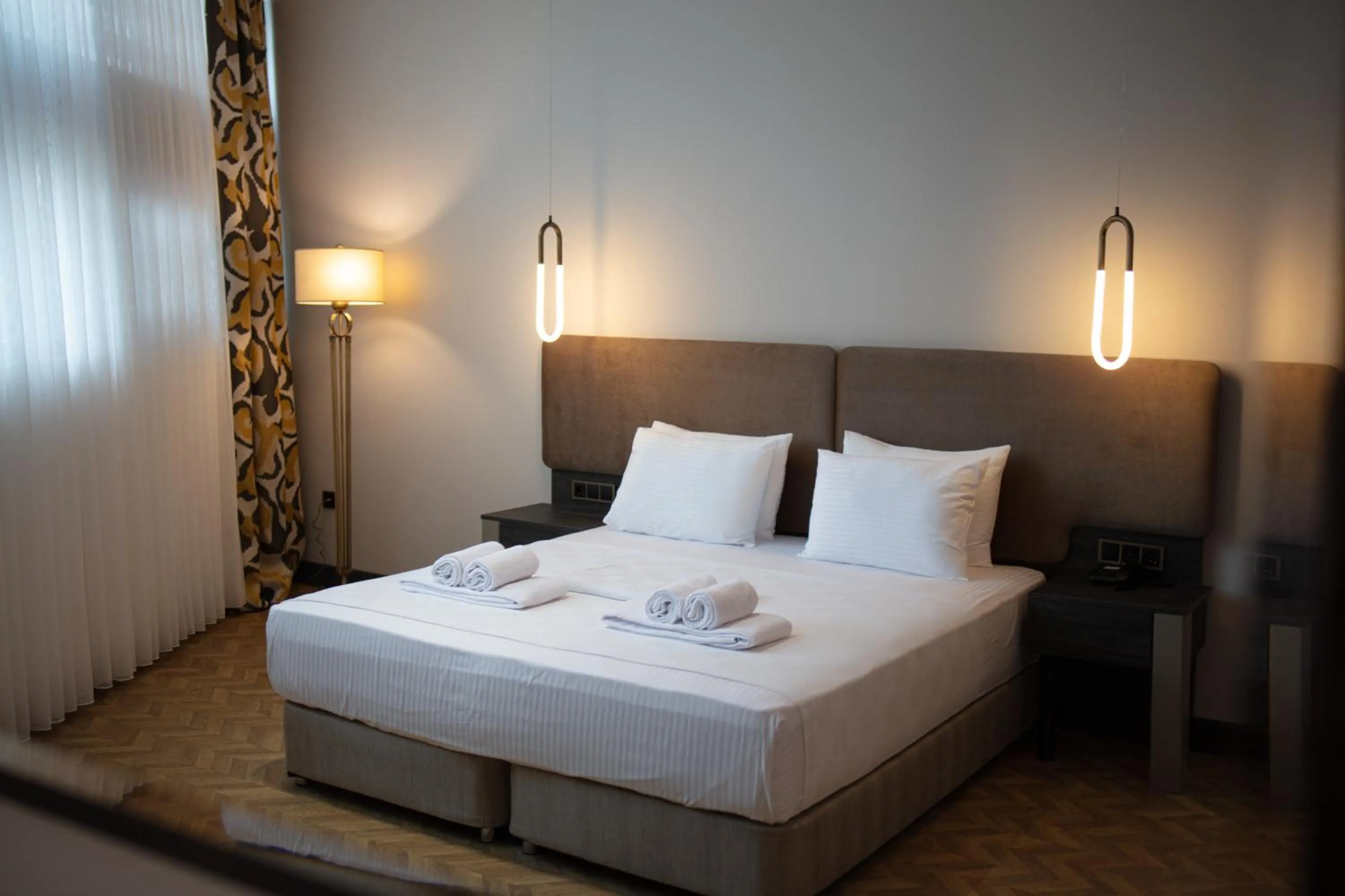 Bed in V Center Hotel