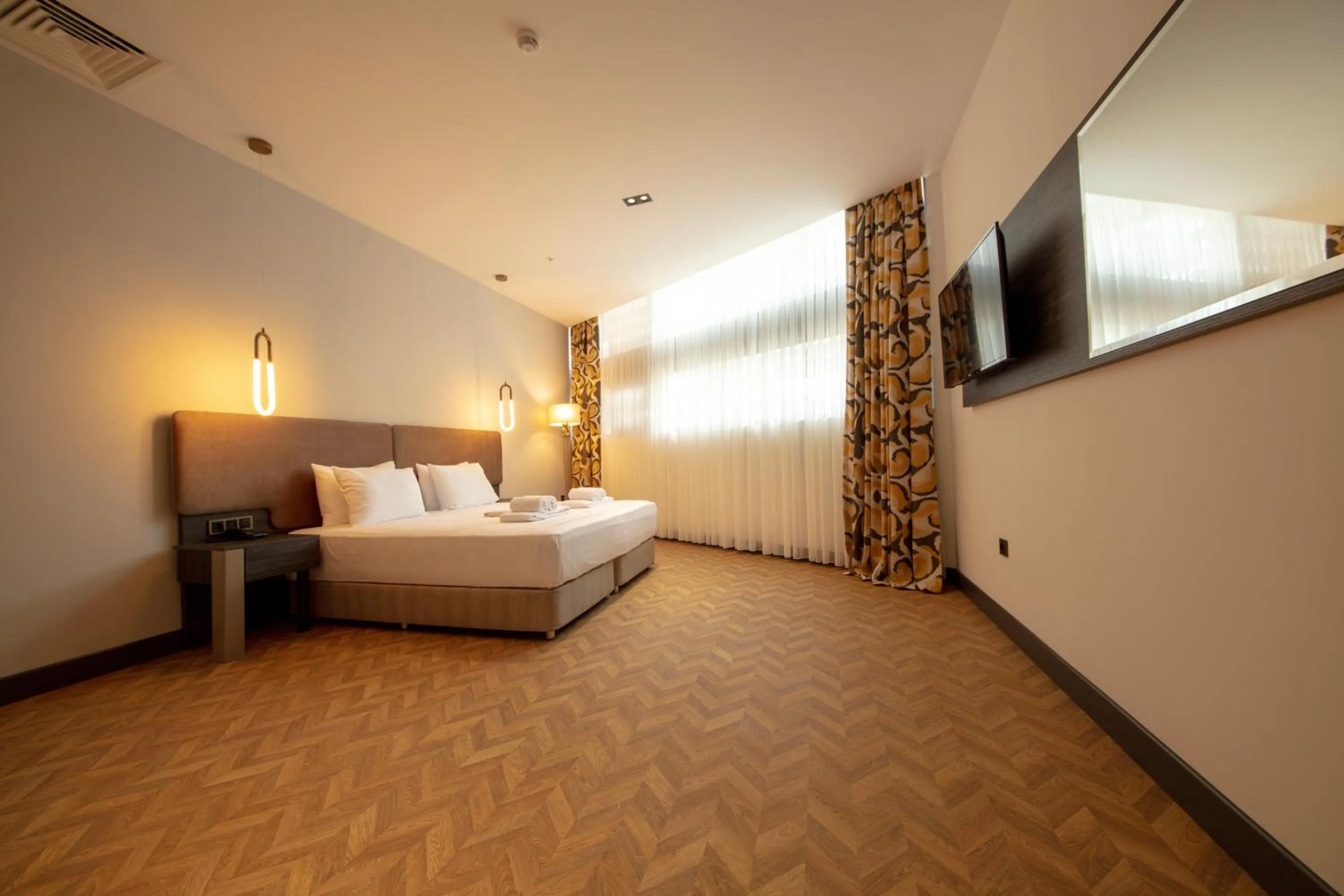 Bed in V Center Hotel