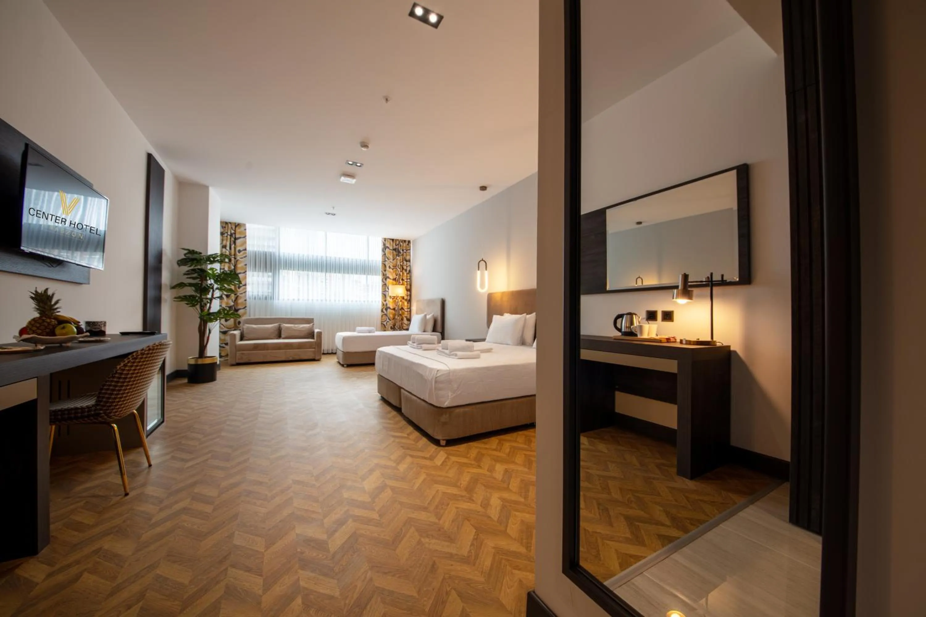 Photo of the whole room, Bed in V Center Hotel