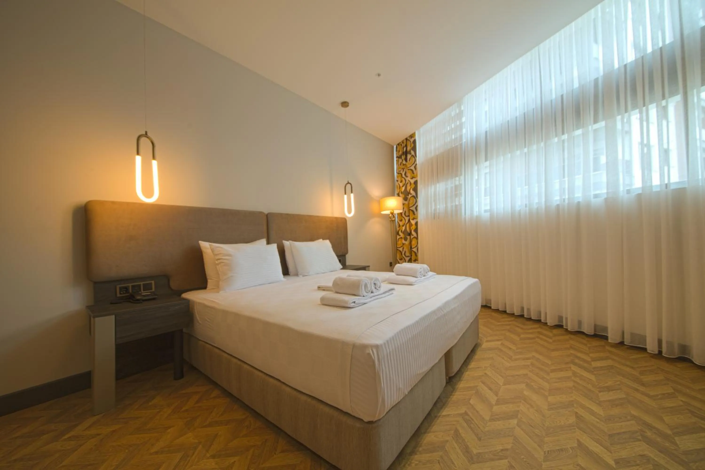 Bed in V Center Hotel