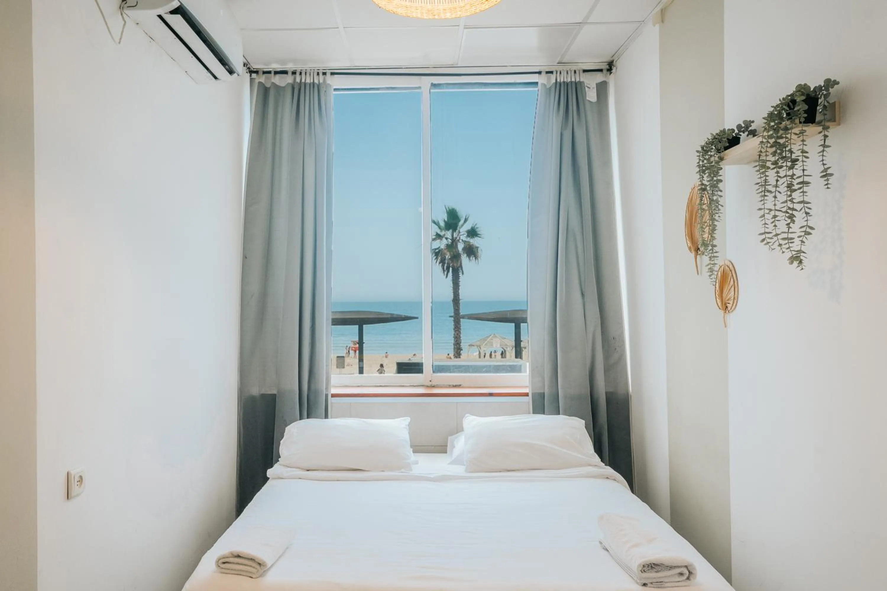 Bed in Central Beach Hotel