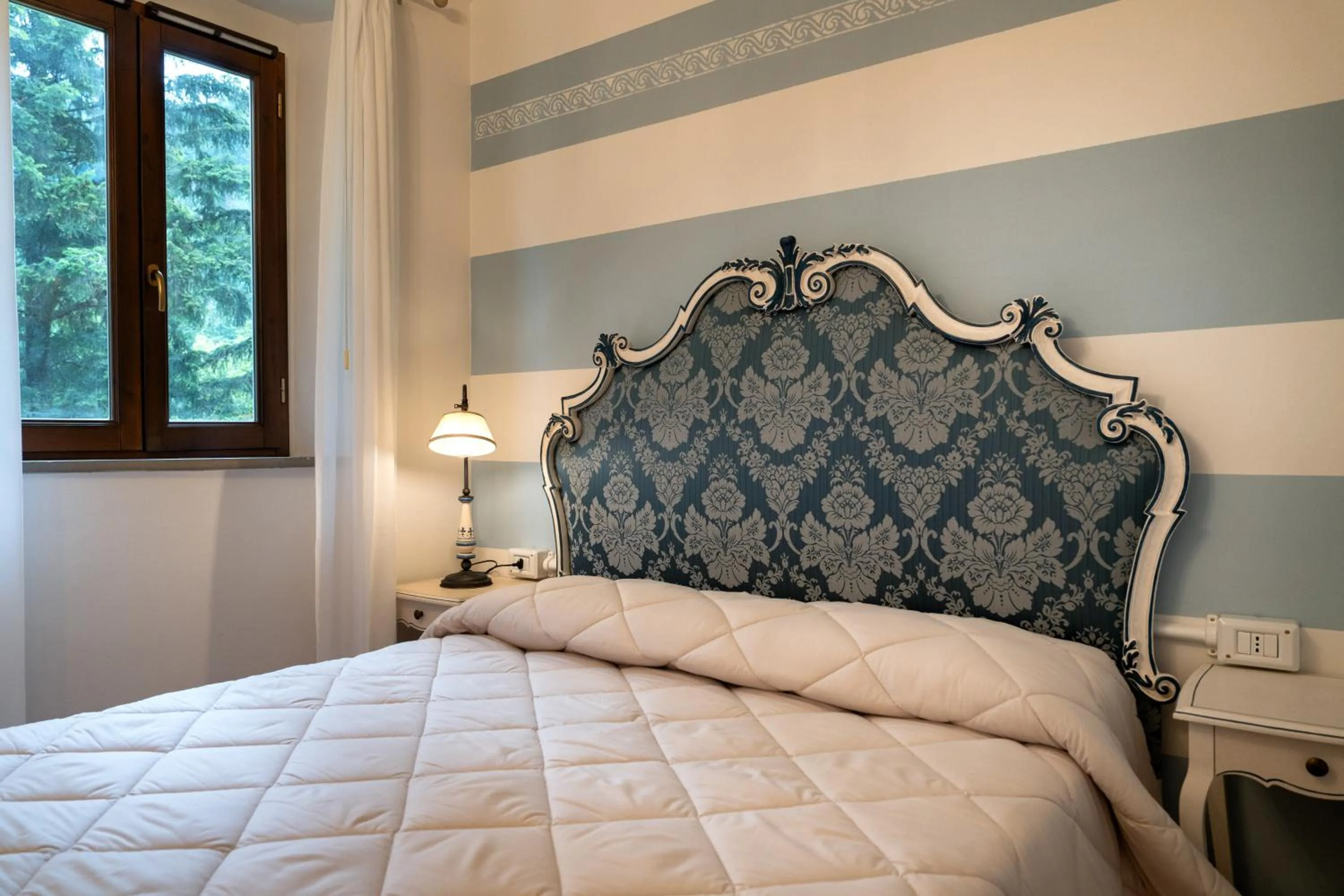 Bed in Hotel Rifugio la Foresta
