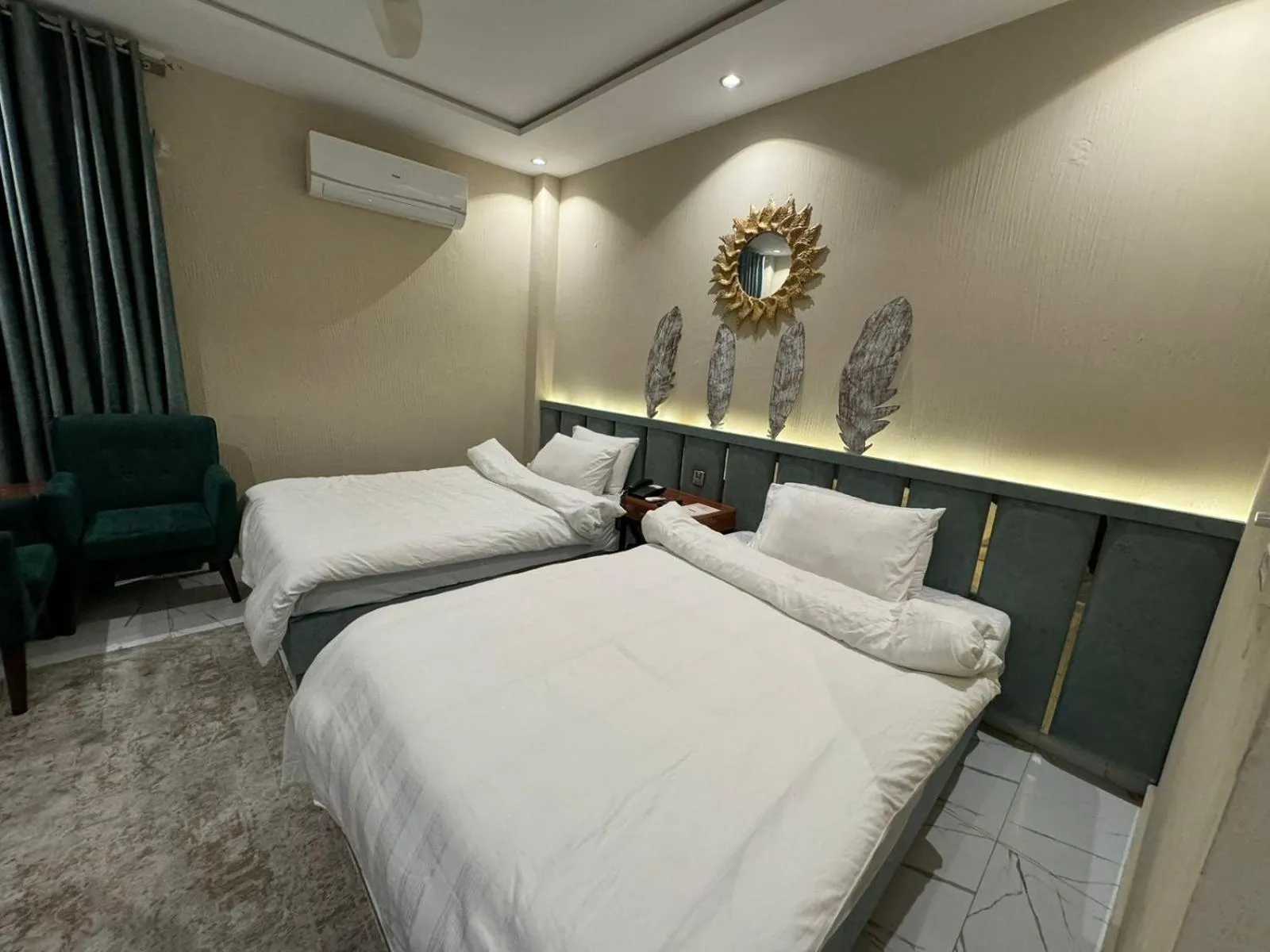 Bed in Shelton Boulevard Hotel Lahore