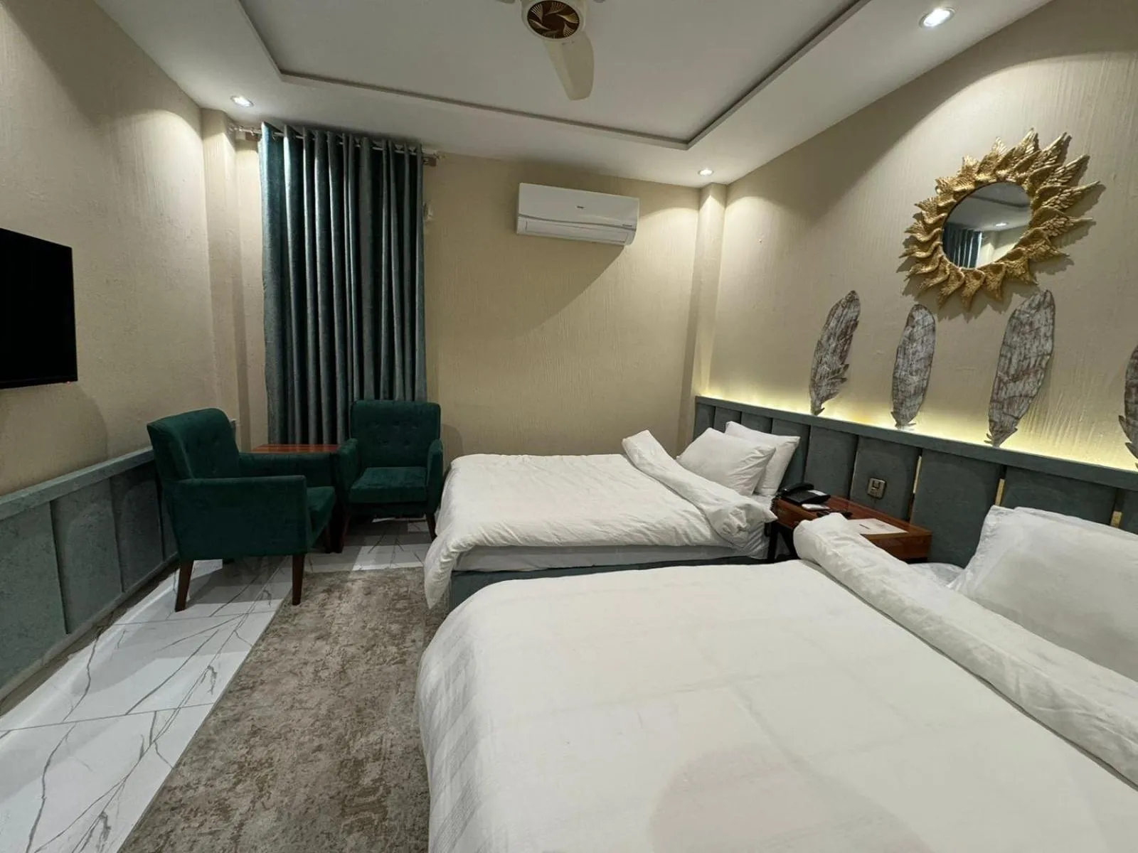 Bed in Shelton Boulevard Hotel Lahore
