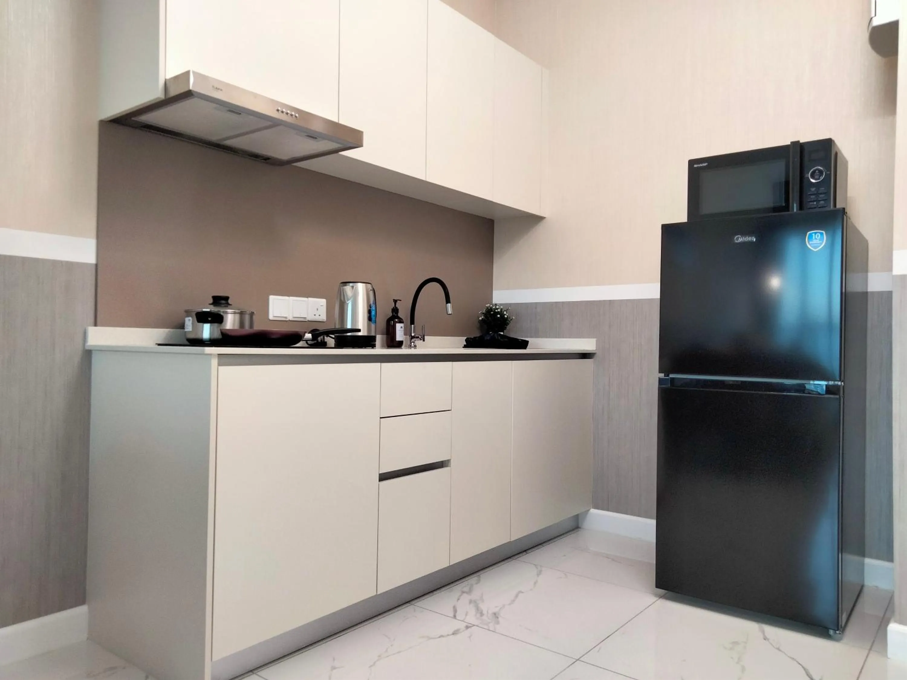 Kitchen or kitchenette in Cubic Botanical Suites Bangsar South by HomeBrickz