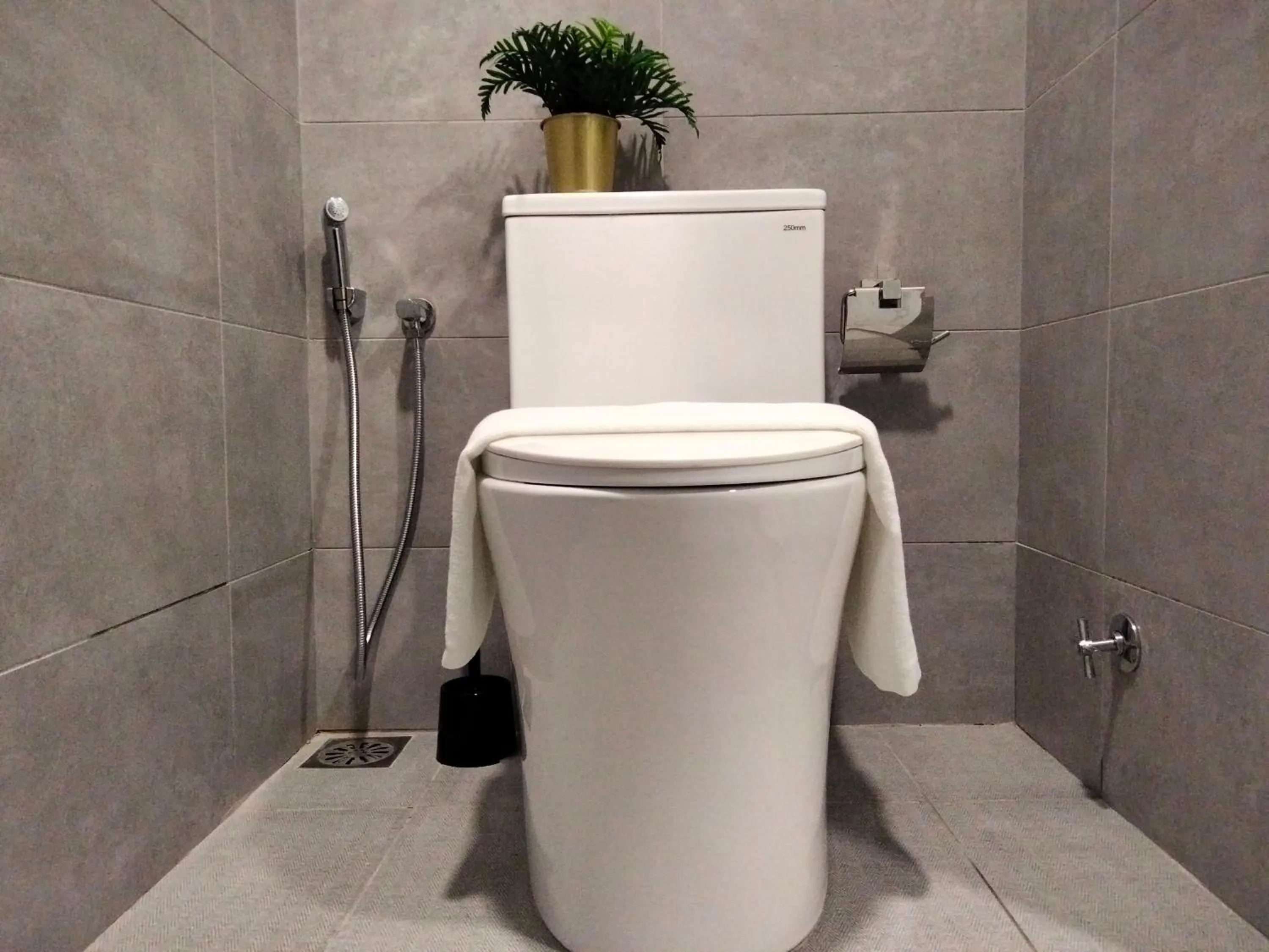 Toilet in Cubic Botanical Suites Bangsar South by HomeBrickz