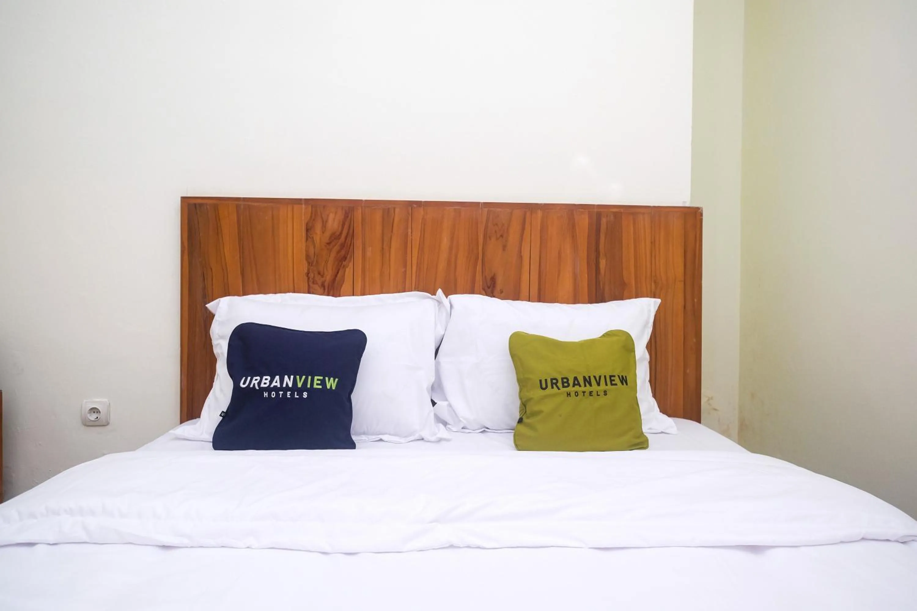 Bed in Urbanview Syariah Kadarman Home Laweyan by RedDoorz