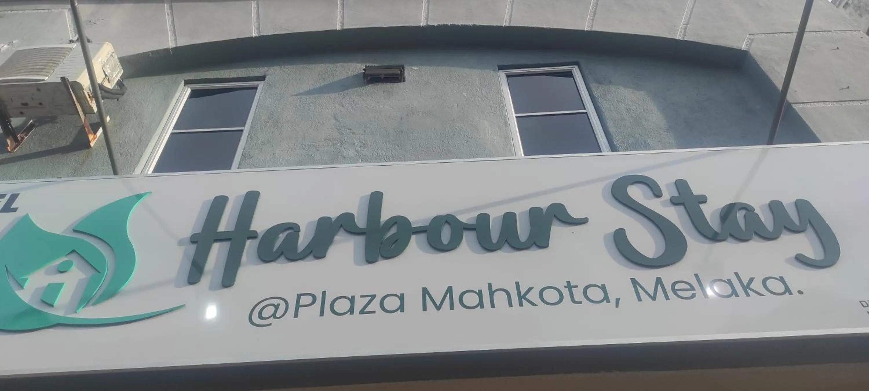 Property logo or sign in Hotel Harbour Stay