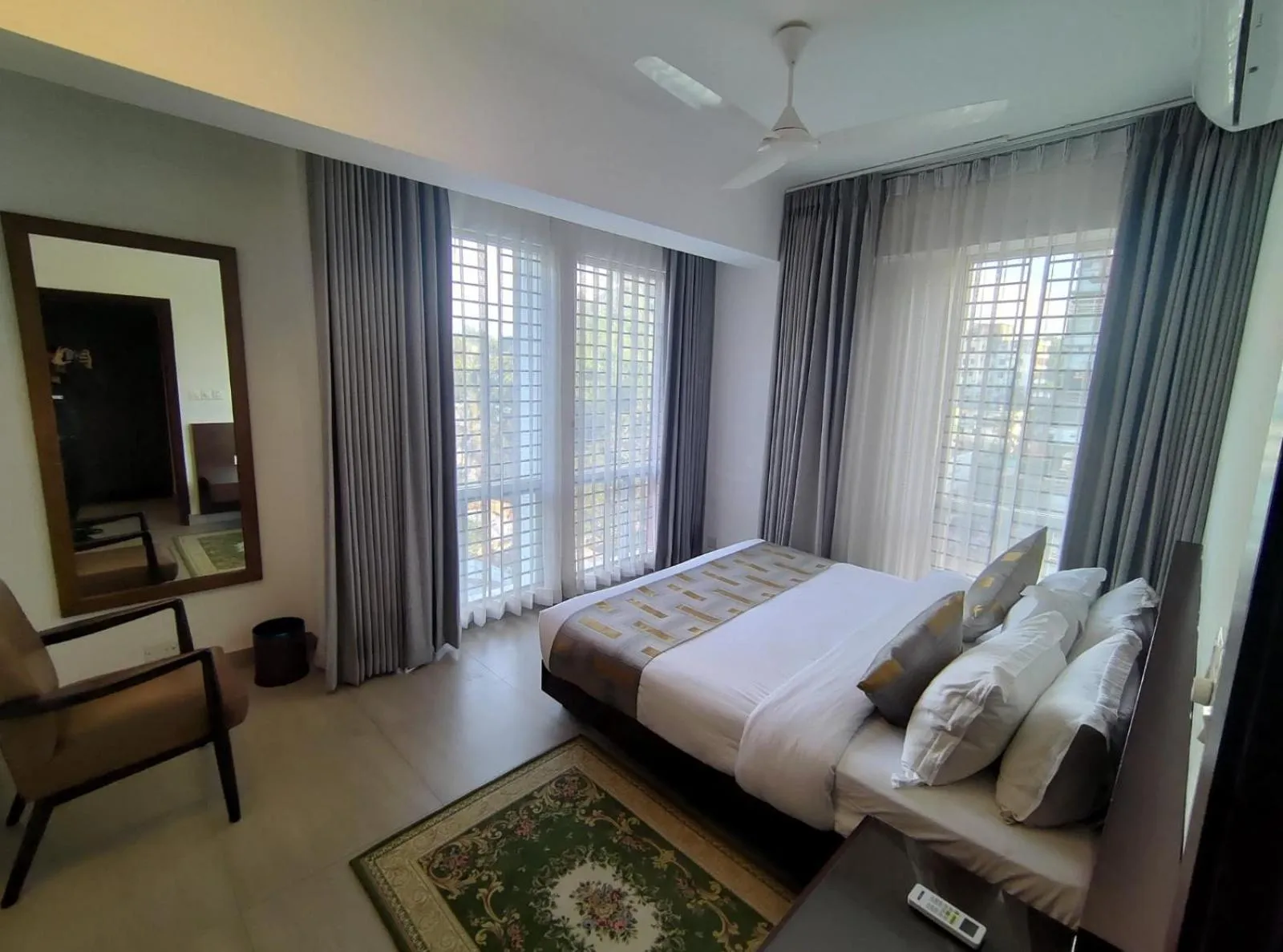 Bed in Royal Pearl Suites