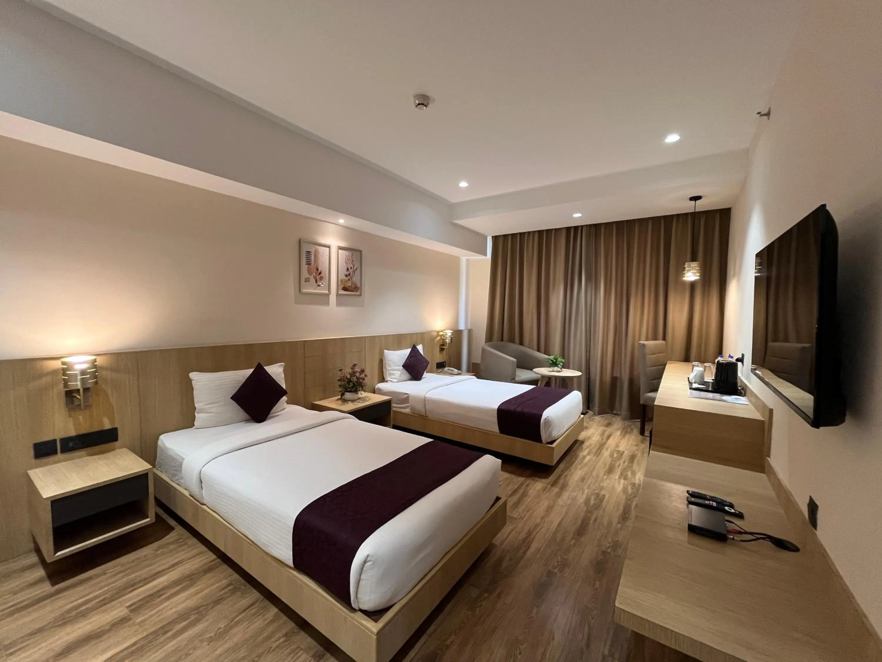 TV and multimedia, Bed in Sachika Hotels, Guwahati