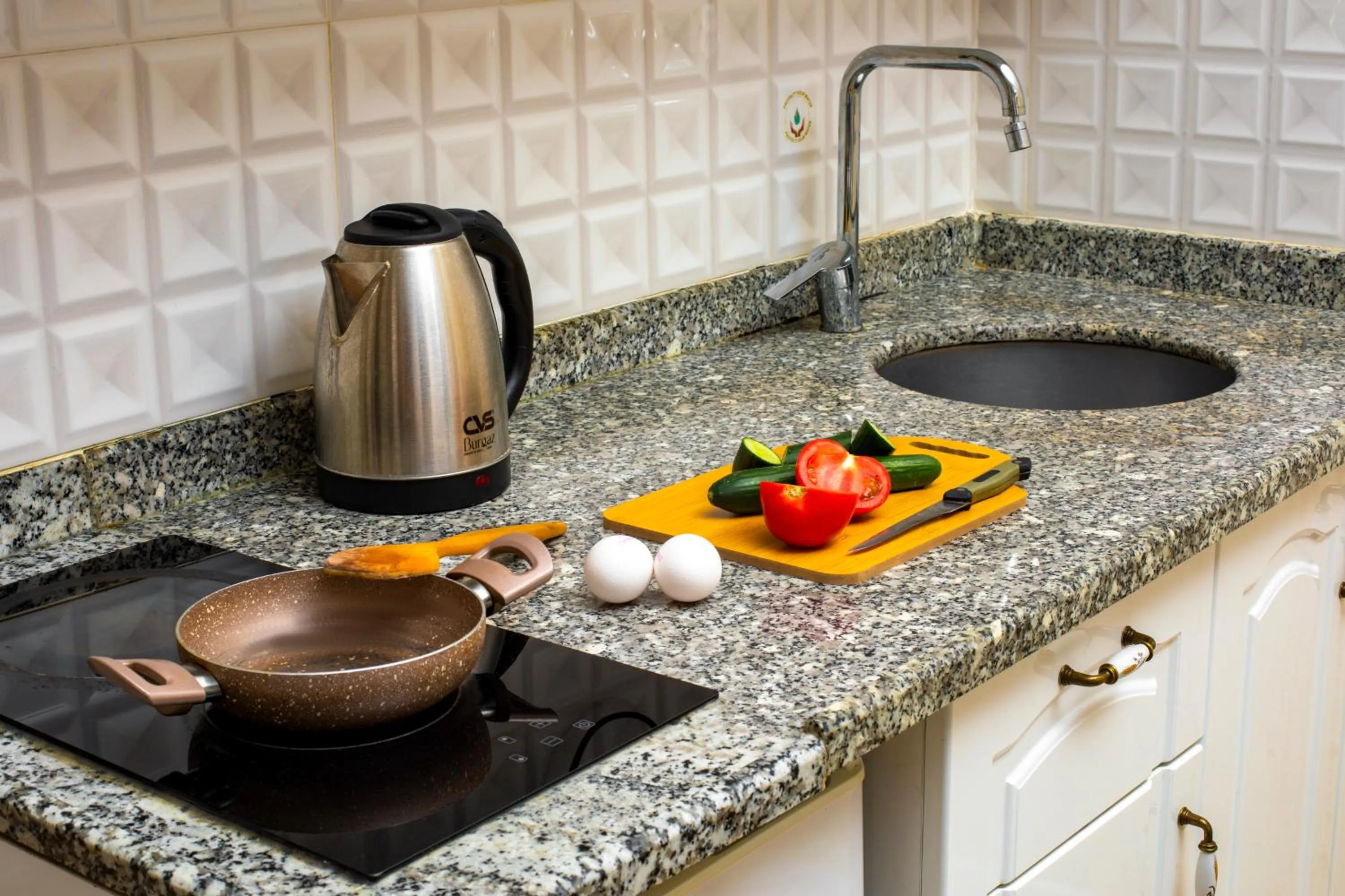 Kitchen or kitchenette in Alhambra Apart Hotel