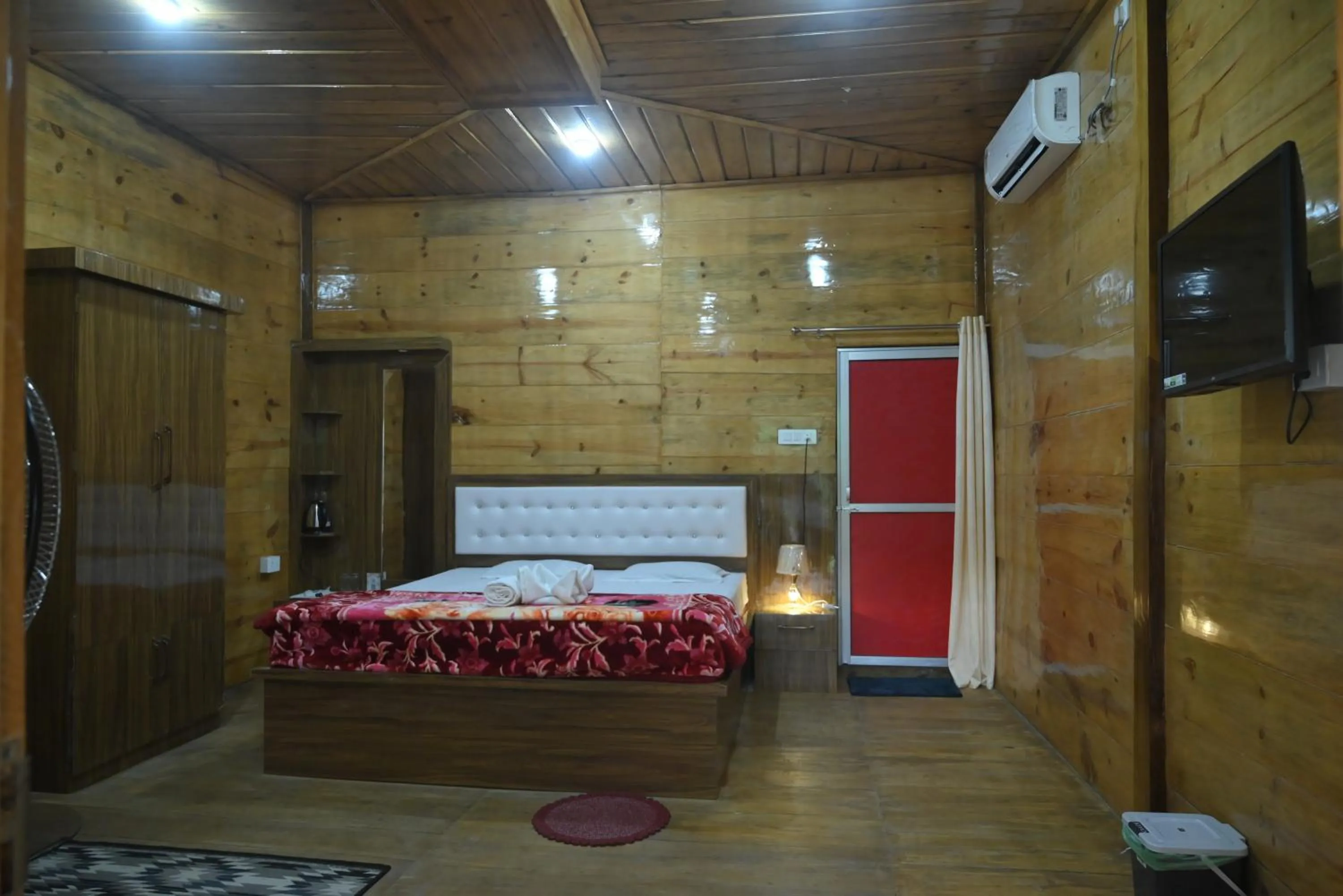 Bed in De Aloha Resort