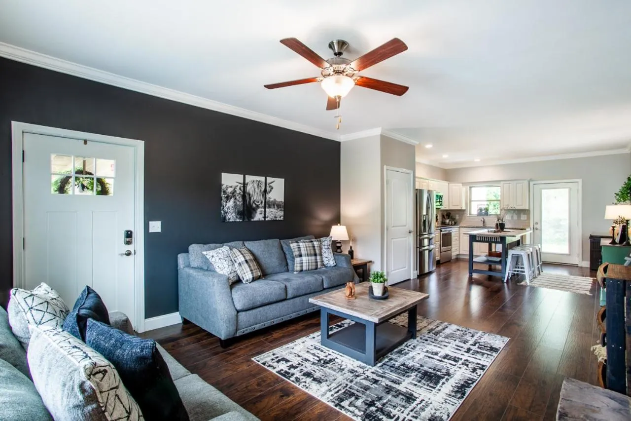 Living room in Elegant End Condo Fireplace Community Amenities