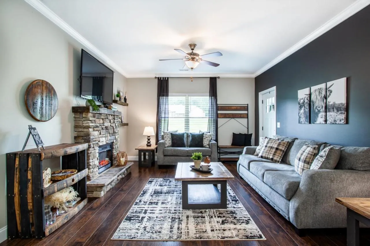 Living room in Elegant End Condo Fireplace Community Amenities