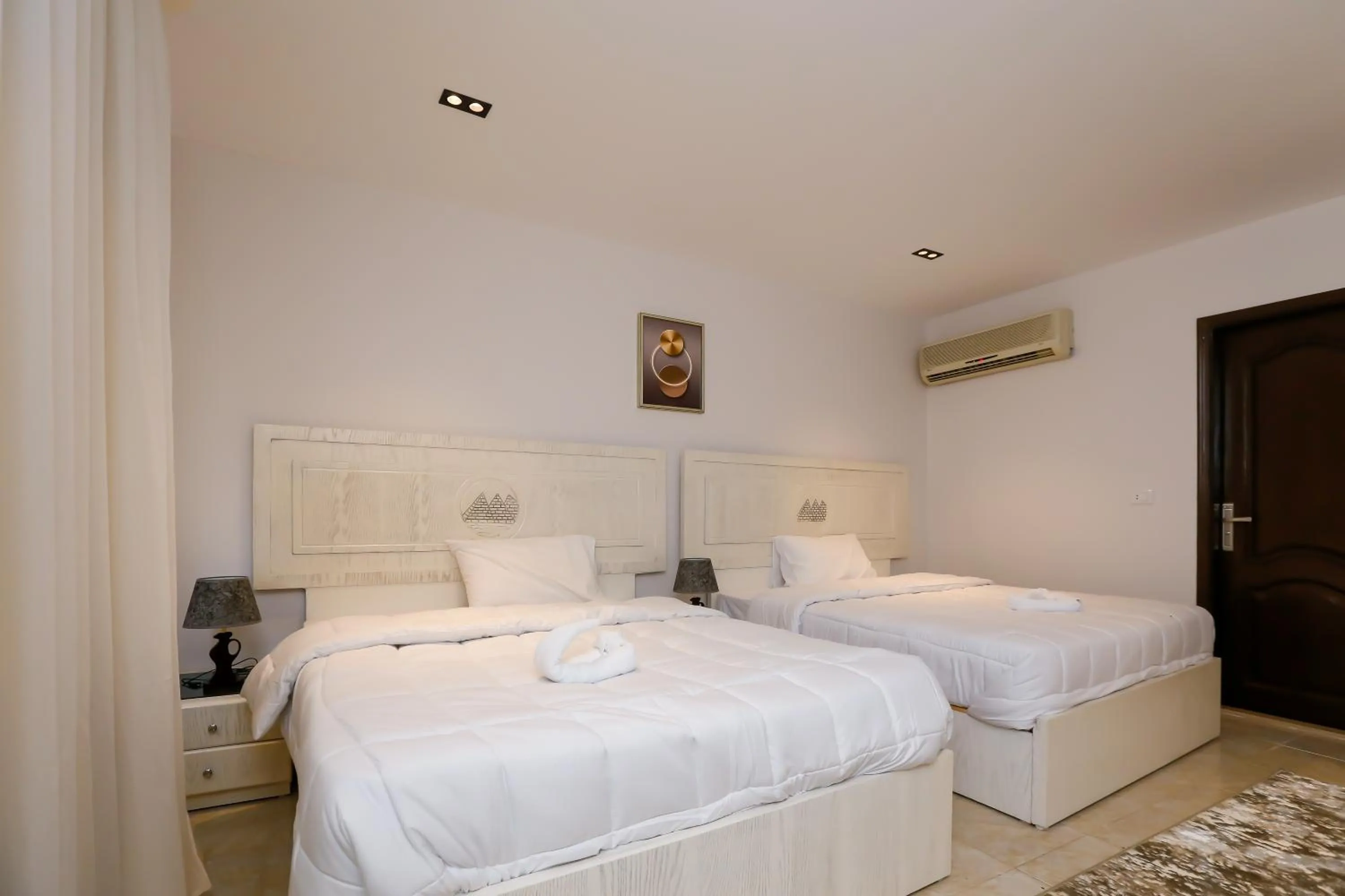 Bed in Pyramids Land Hotel