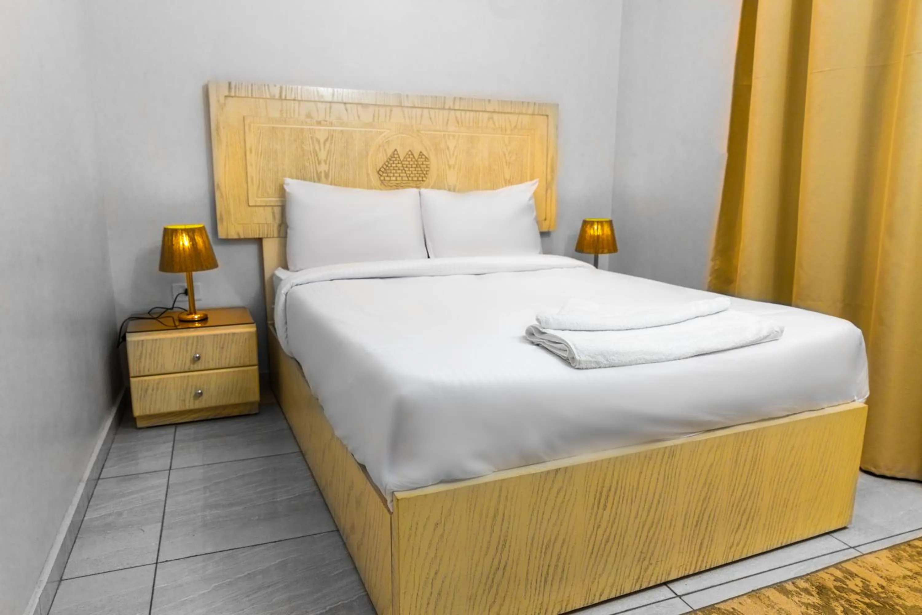 Bed in Pyramids Land Hotel