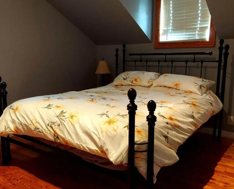 Bed in Auberge Le P'tit Bonheur