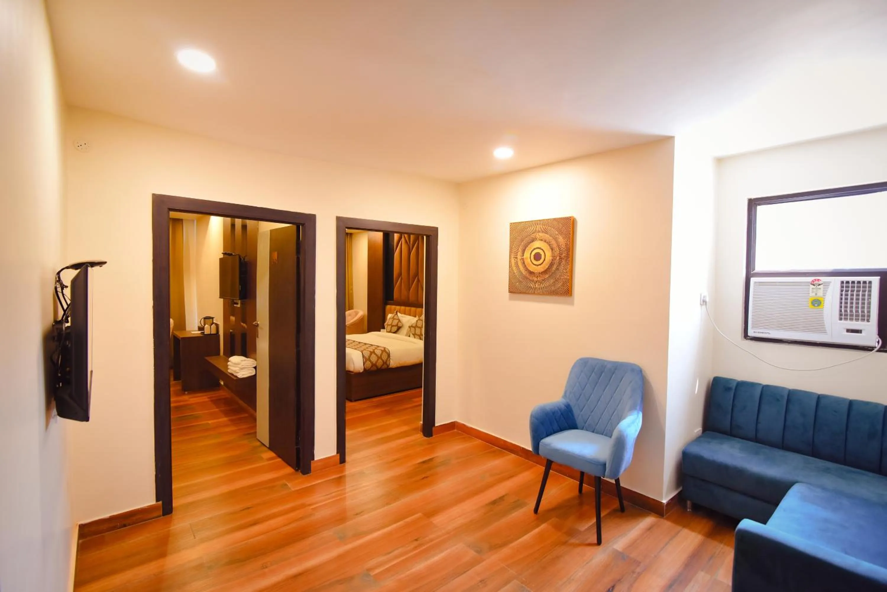 Living room, Bed in Hotel Swagat Suites