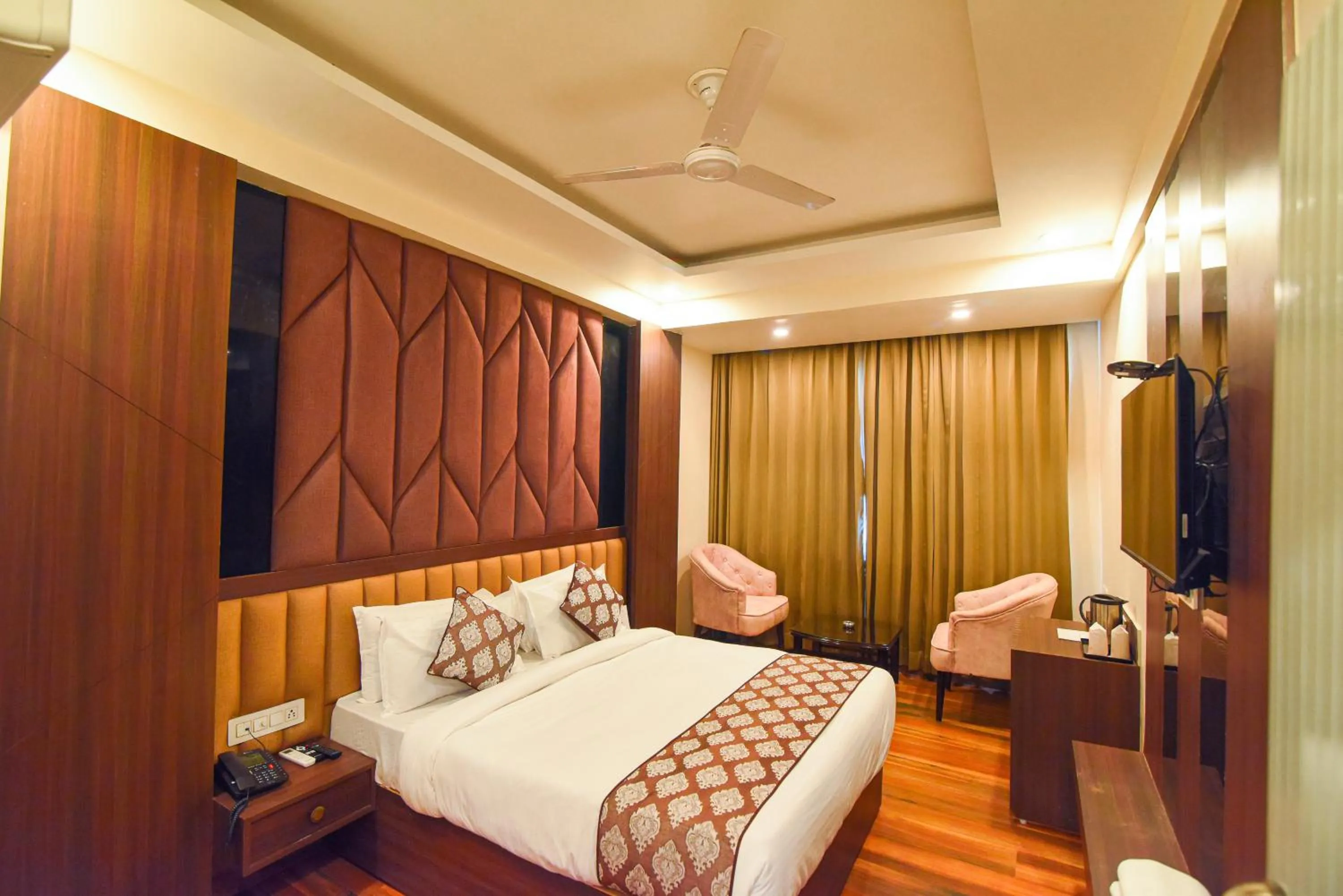 Bed in Hotel Swagat Suites