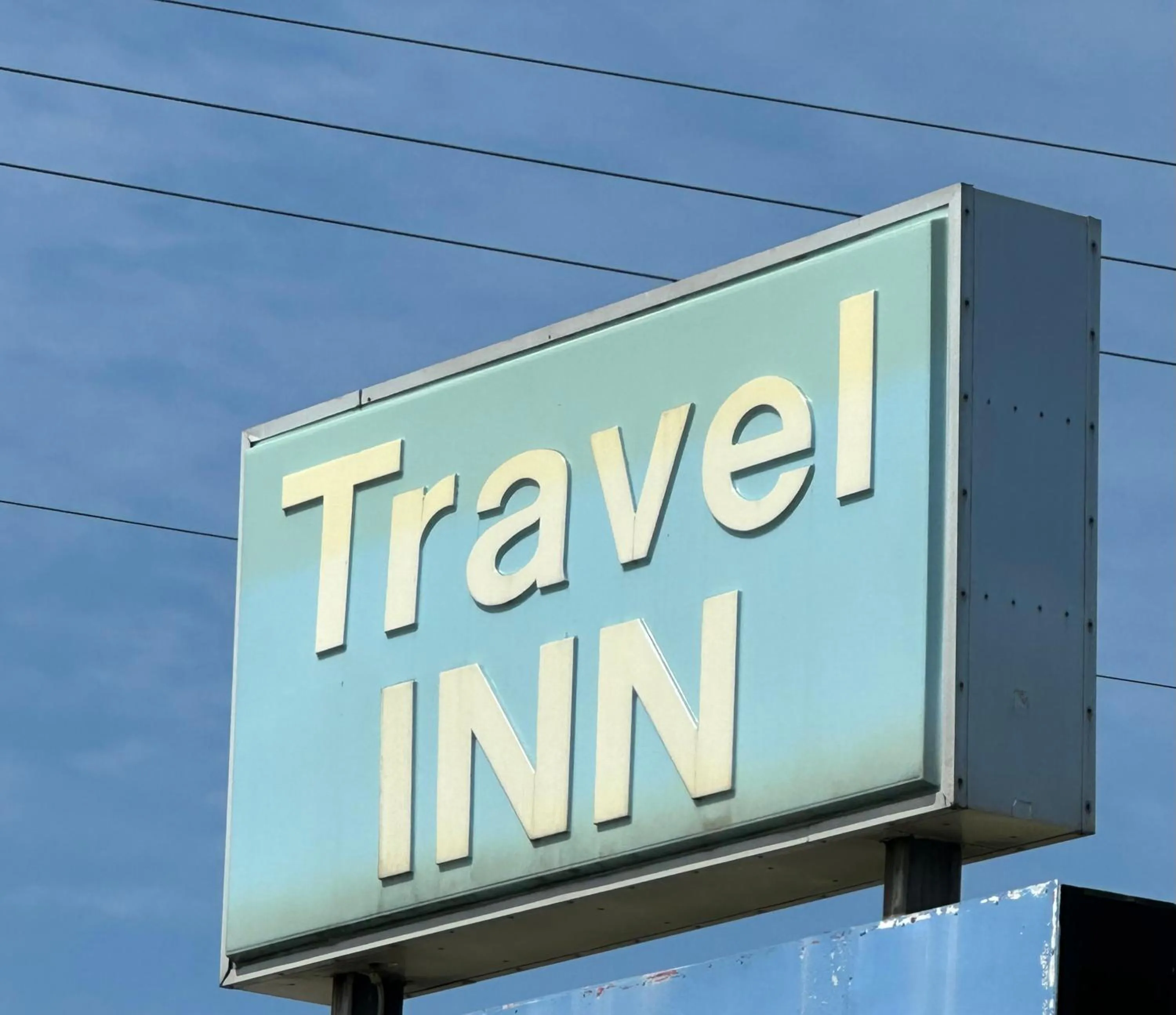 Logo/Certificate/Sign in Travel Inn Montgomery AL
