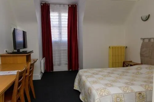 Bed in Hôtel de la cloche