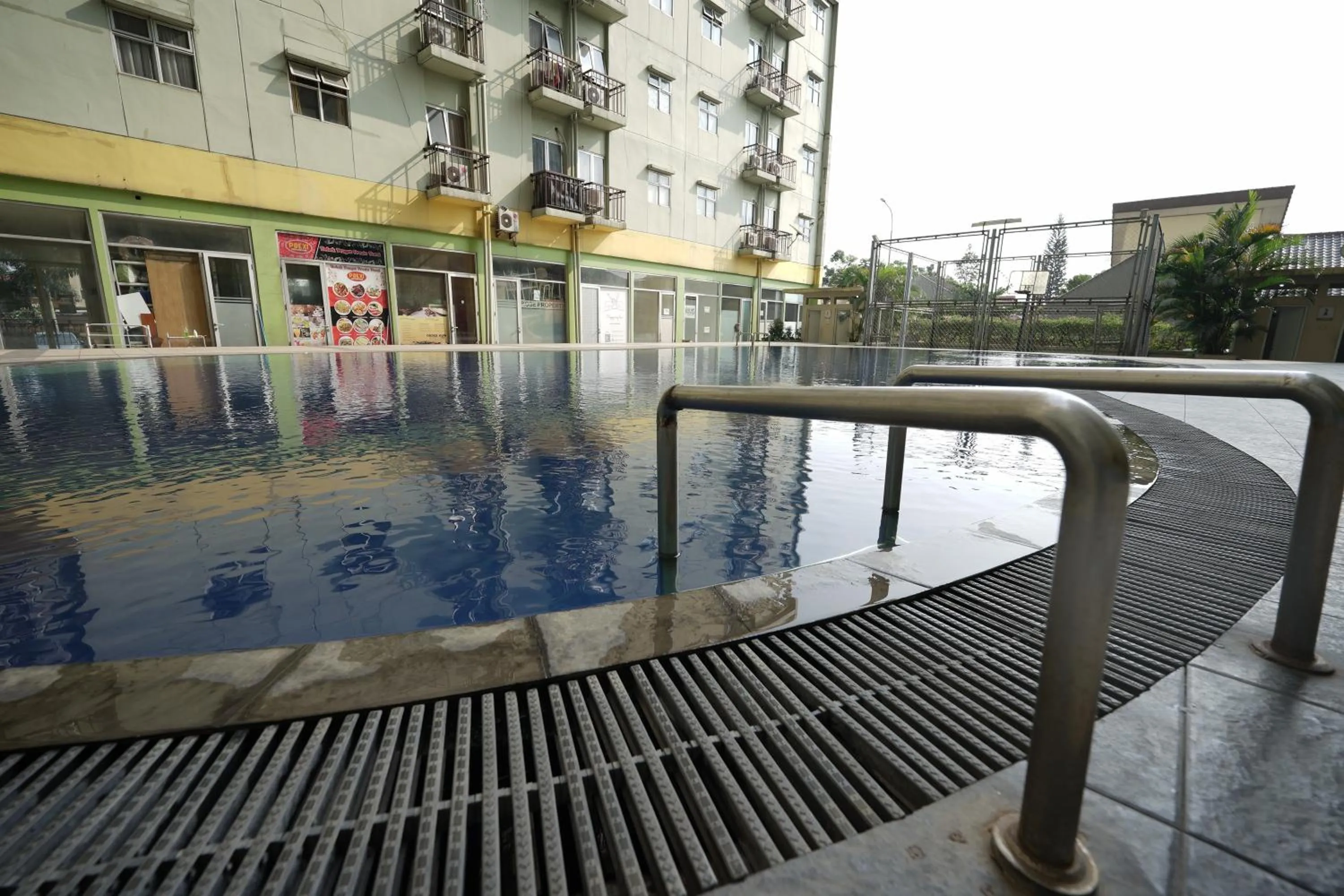 Swimming pool in Perfect Stay Apartement The Suites Metro Bandung By Sultan Property