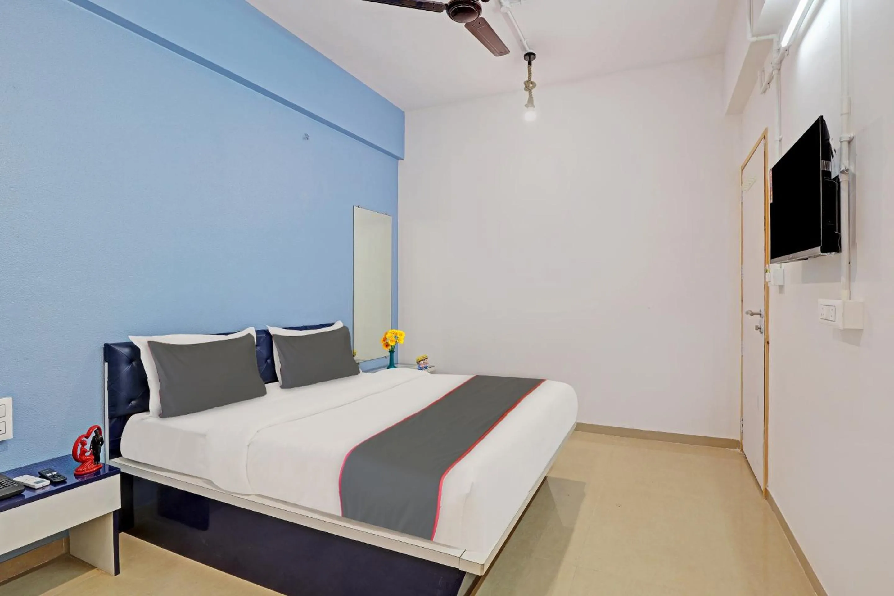 Communal lounge/ TV room, Bed in Hotel Solitaire, Best Luxurious Hotel AC Rooms In Surat