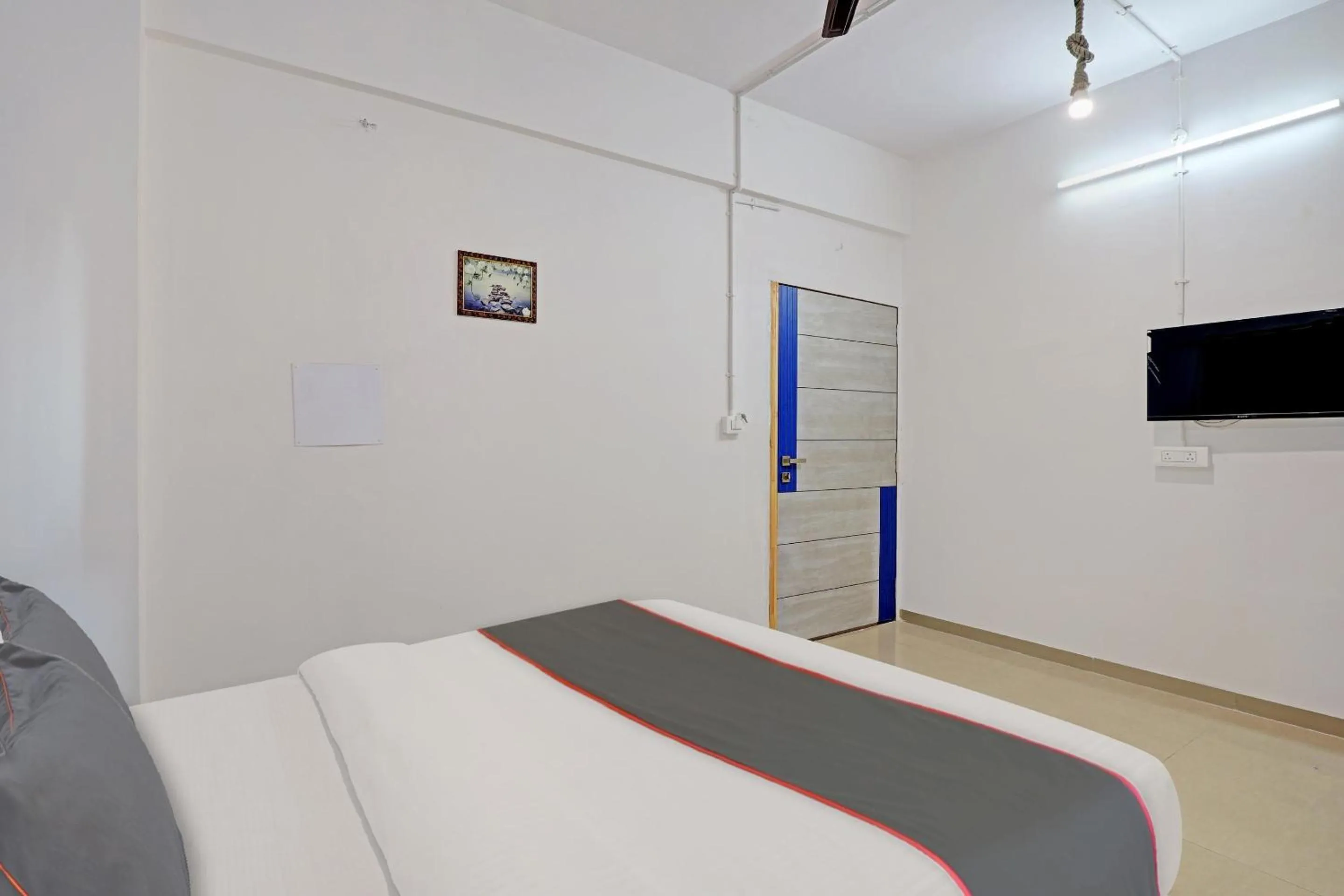 Communal lounge/ TV room, Bed in Hotel Solitaire, Best Luxurious Hotel AC Rooms In Surat
