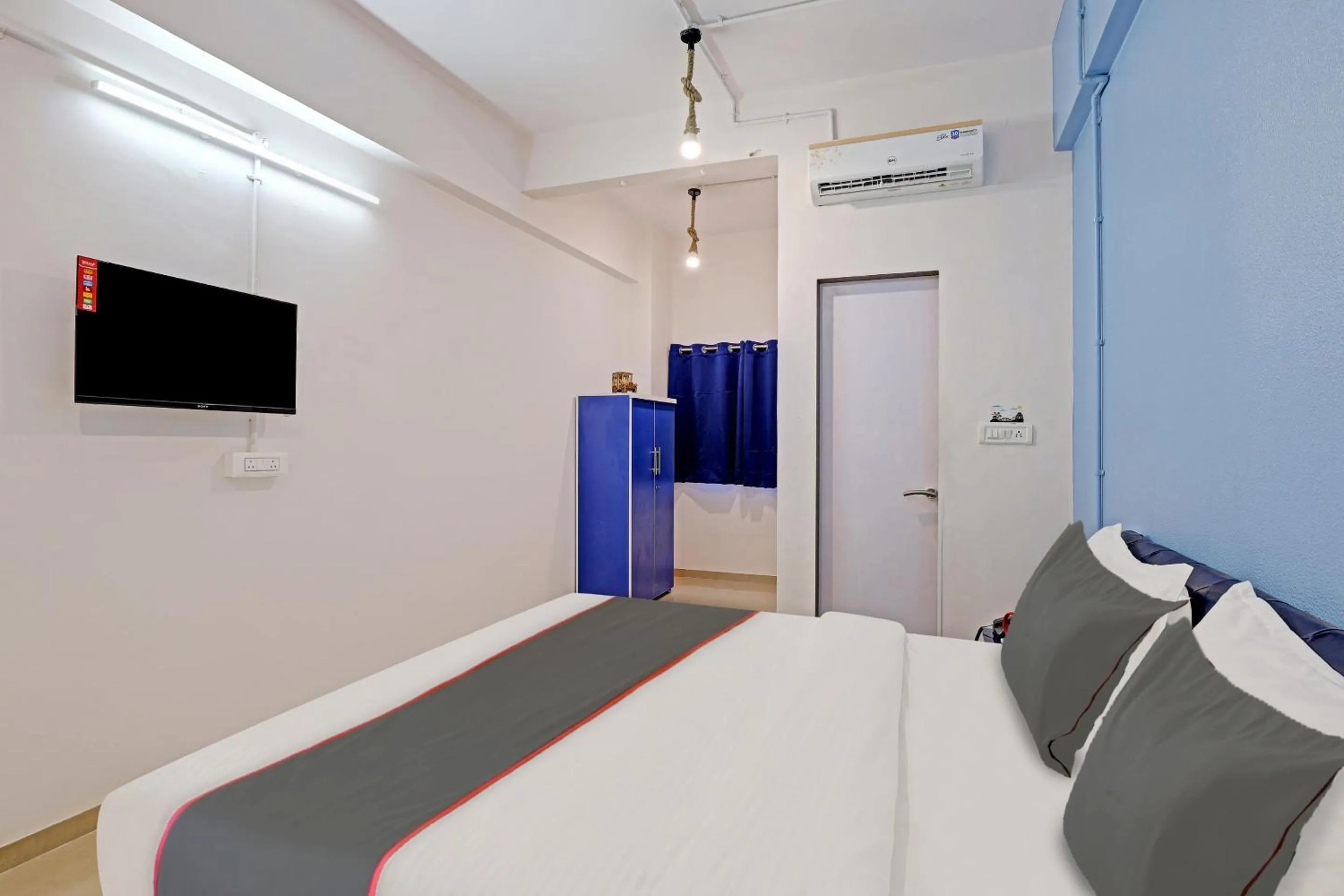 Communal lounge/ TV room, Bed in Hotel Solitaire, Best Luxurious Hotel AC Rooms In Surat