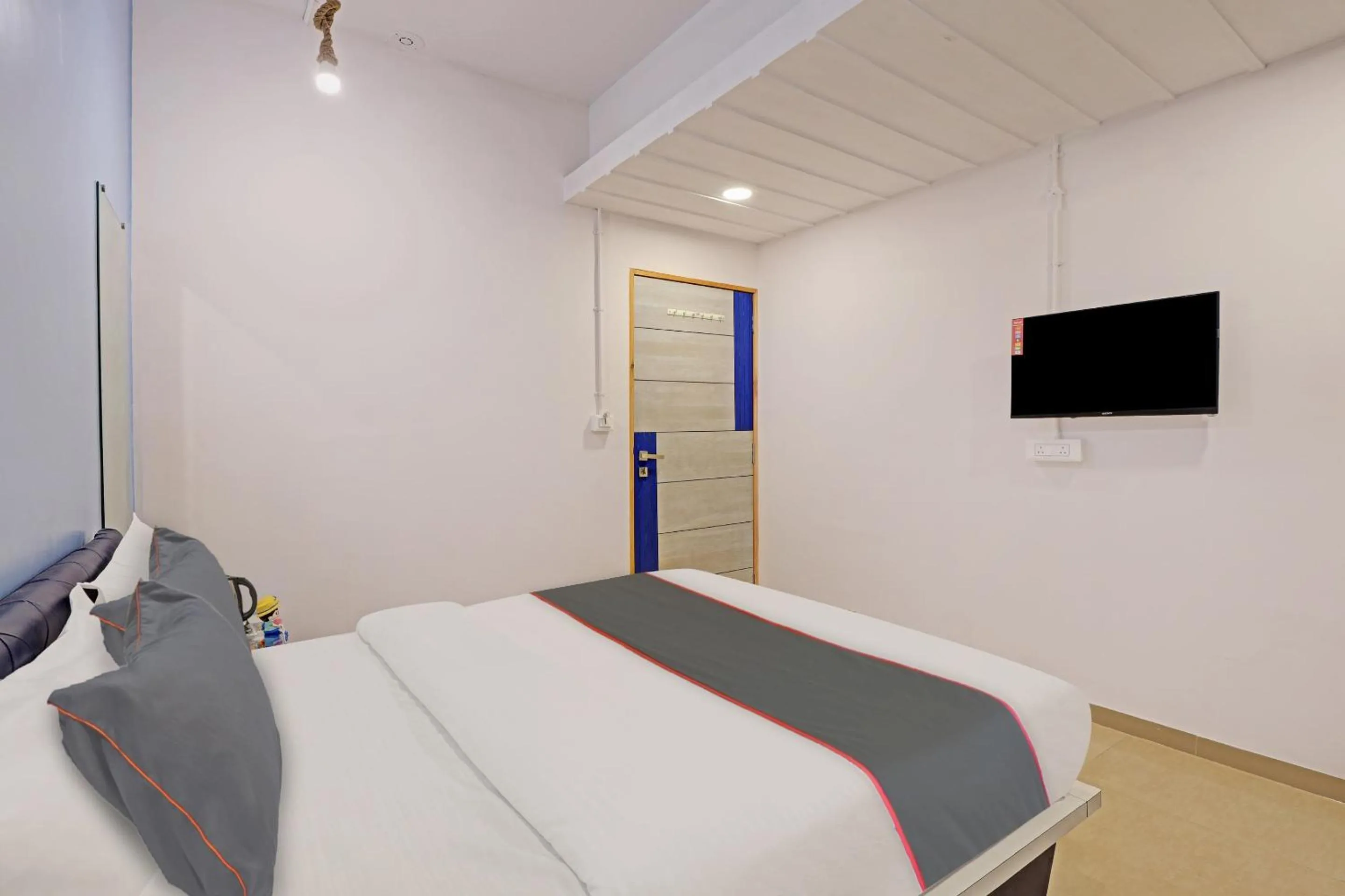 Communal lounge/ TV room, Bed in Hotel Solitaire, Best Luxurious Hotel AC Rooms In Surat