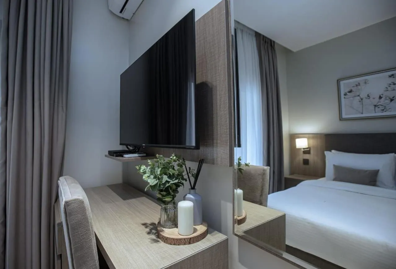 Bed in Knightsbridge Hotel & Suites