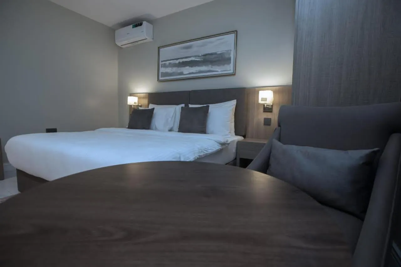 Bed in Knightsbridge Hotel & Suites