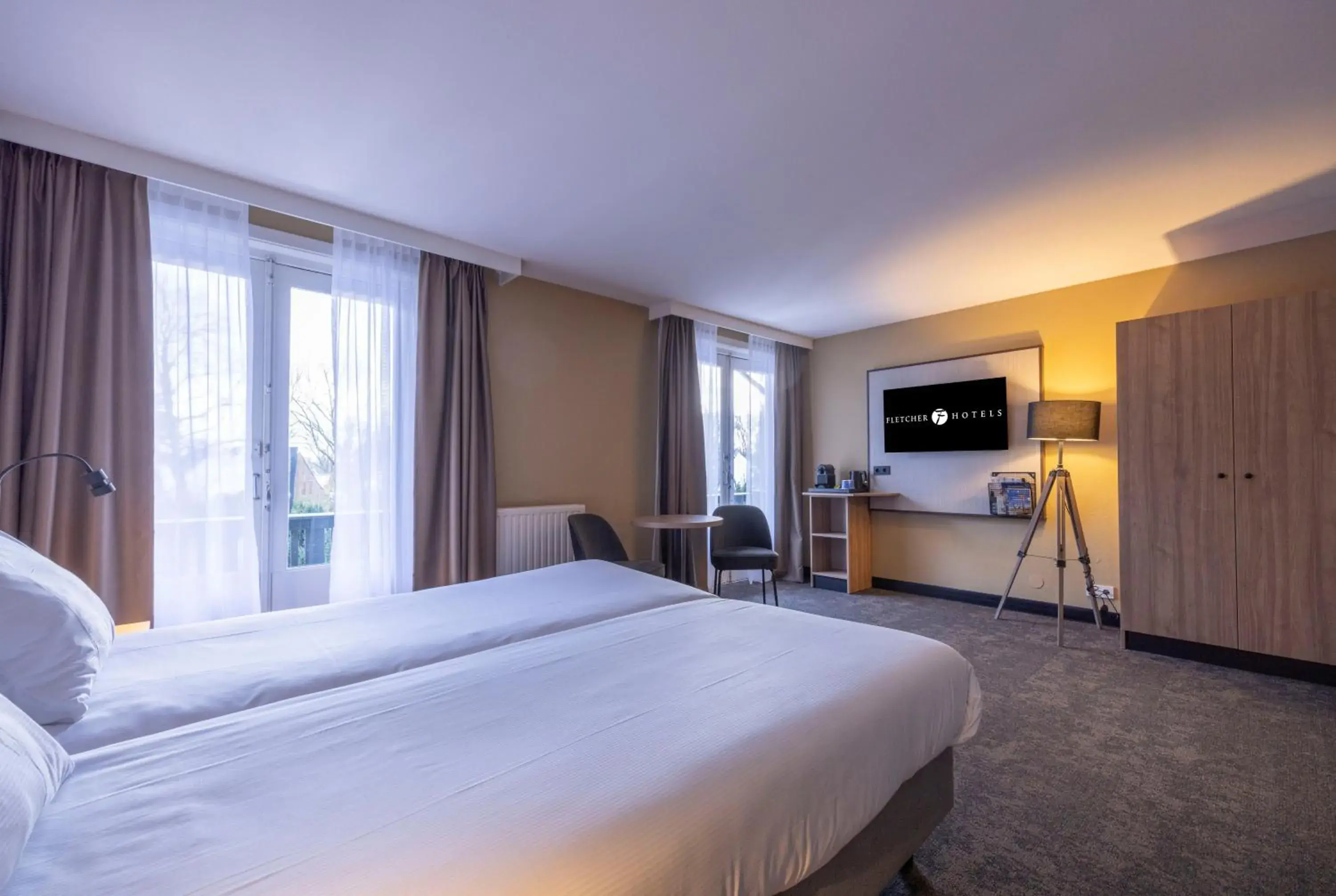 Bed in Fletcher Hotel-Restaurant Klein Zwitserland Bed in Fletcher Hotel-Restaurant Klein Zwitserland