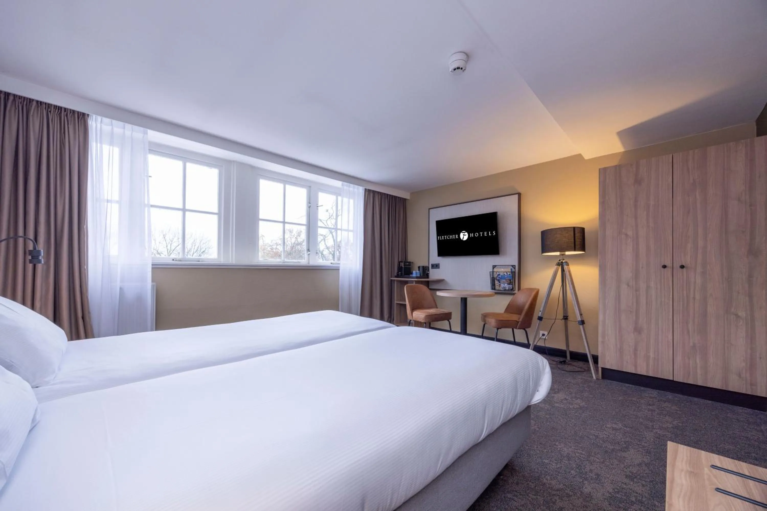 Bed in Fletcher Hotel-Restaurant Klein Zwitserland