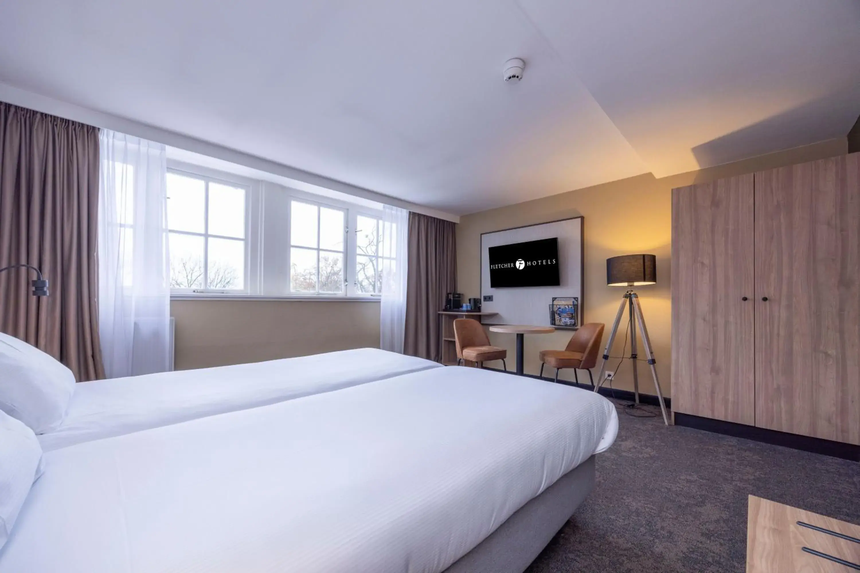 Bed in Fletcher Hotel-Restaurant Klein Zwitserland Bed in Fletcher Hotel-Restaurant Klein Zwitserland