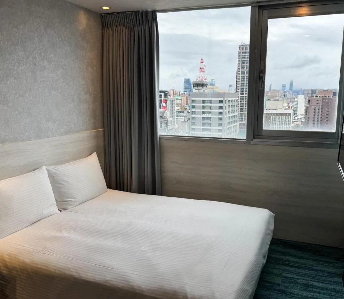 Bed in 西門雲町旅店 Sky Gate Hotel