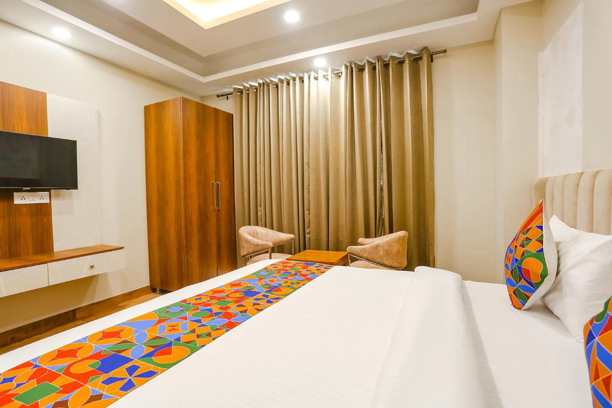 Communal lounge/ TV room, Bed in FabHotel Raahi Retreat - Nr Star Mall & 32nd Avenue