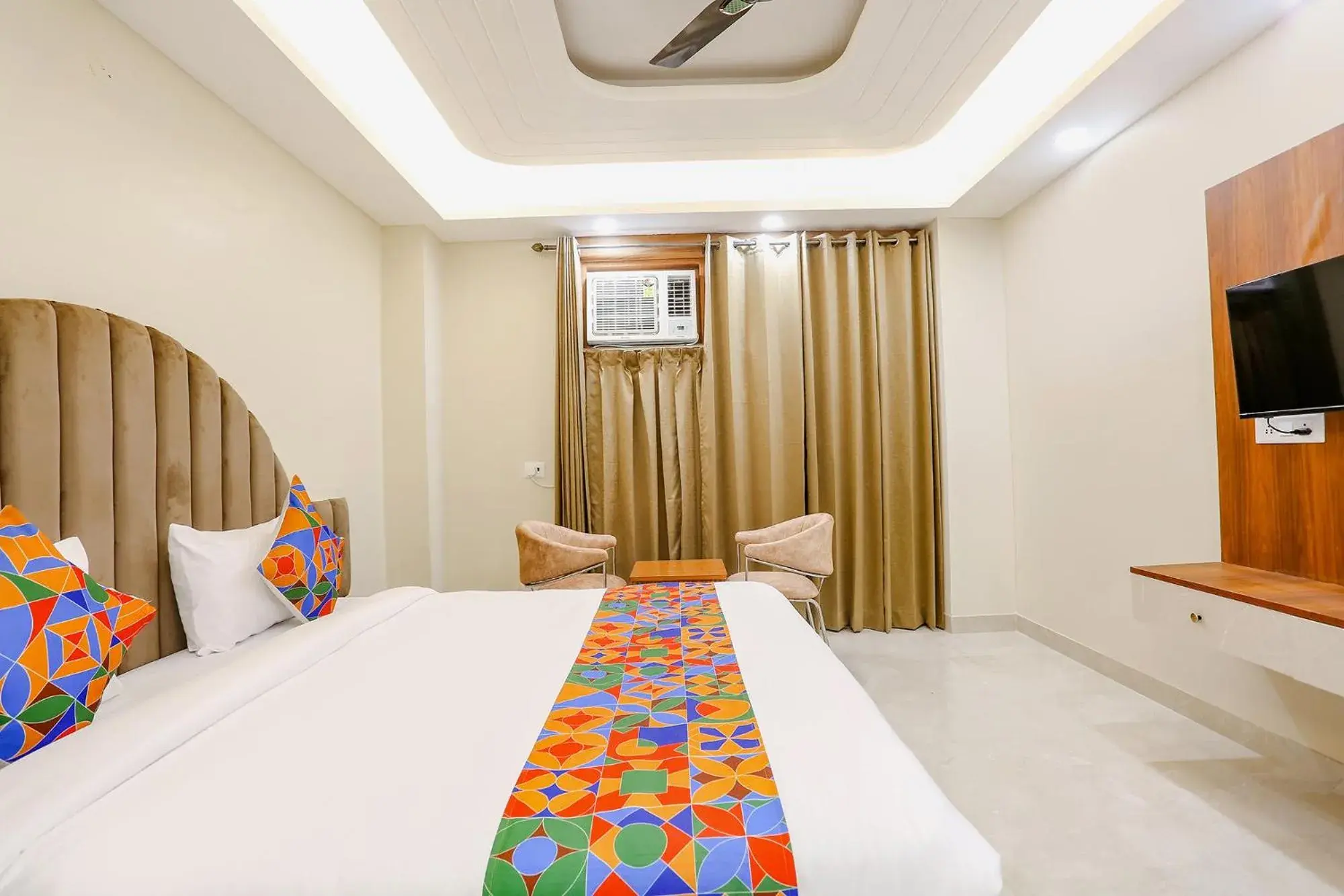 Communal lounge/ TV room, Bed in FabHotel Raahi Retreat - Nr Star Mall & 32nd Avenue Communal lounge/ TV room, Bed in FabHotel Raahi Retreat - Nr Star Mall & 32nd Avenue
