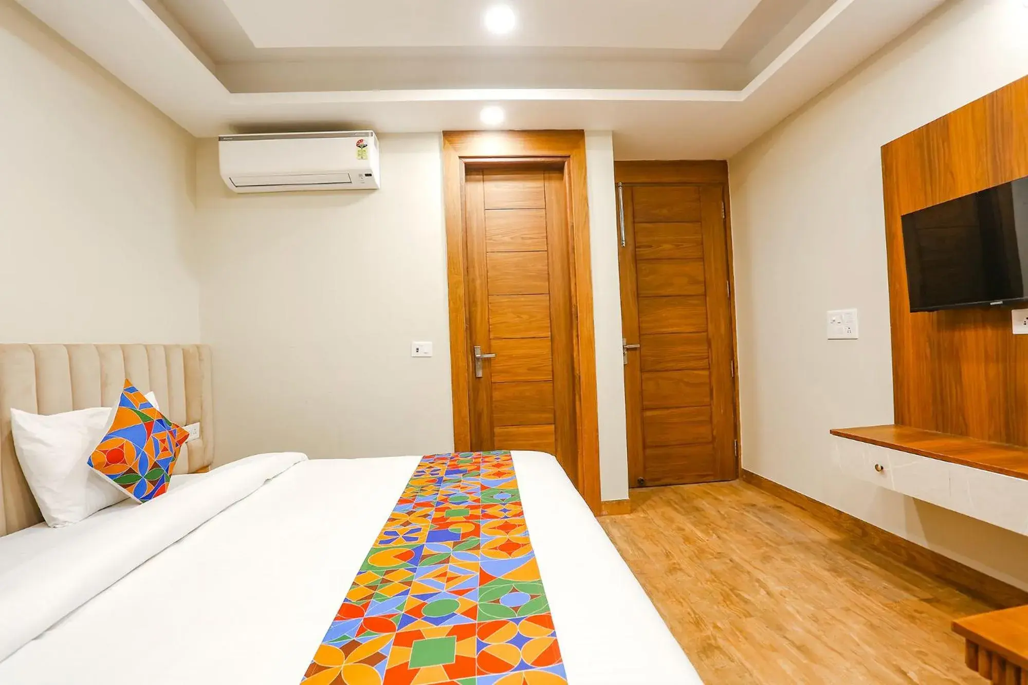 Communal lounge/ TV room, Bed in FabHotel Raahi Retreat - Nr Star Mall & 32nd Avenue Communal lounge/ TV room, Bed in FabHotel Raahi Retreat - Nr Star Mall & 32nd Avenue