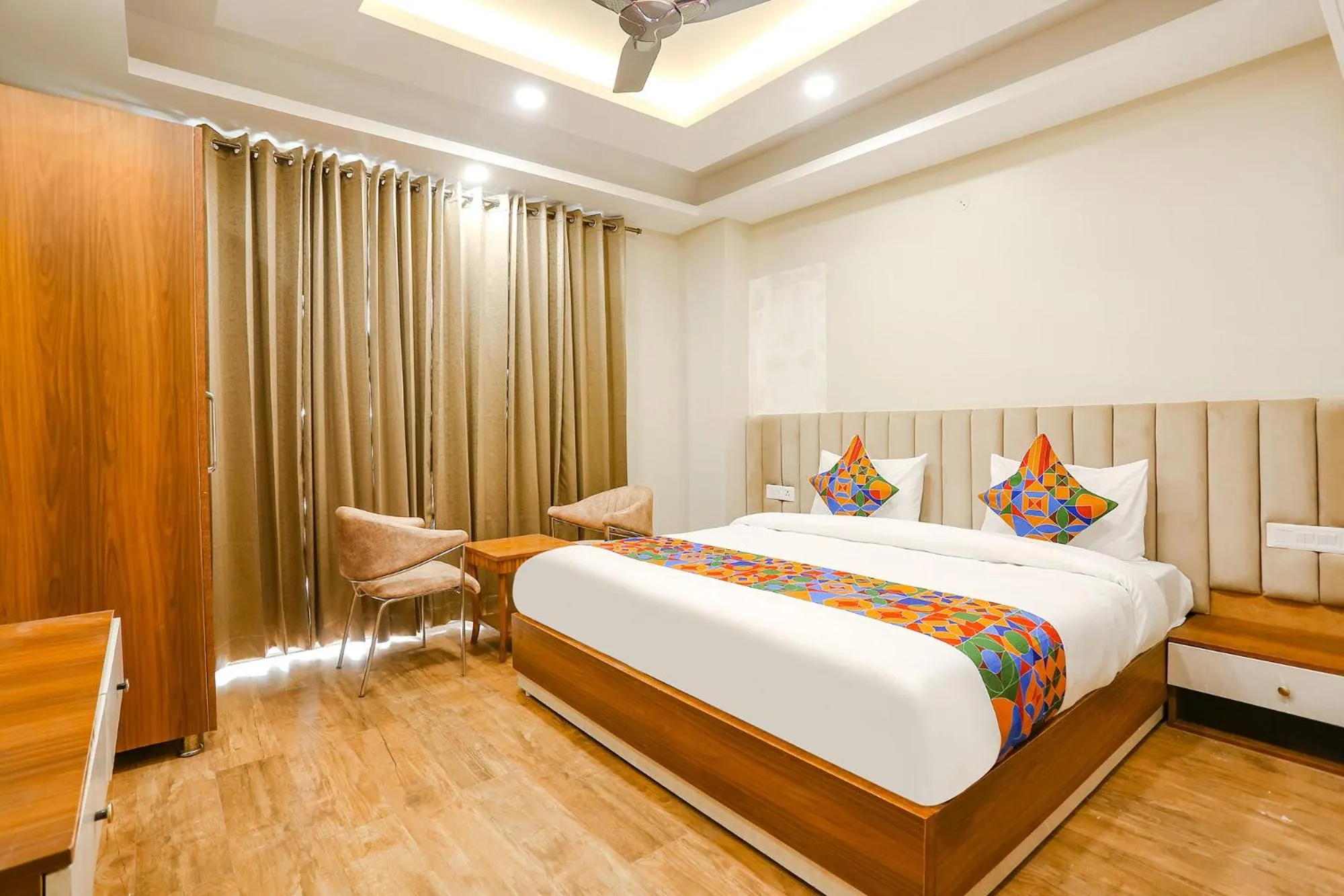 Living room, Bed in FabHotel Raahi Retreat - Nr Star Mall & 32nd Avenue