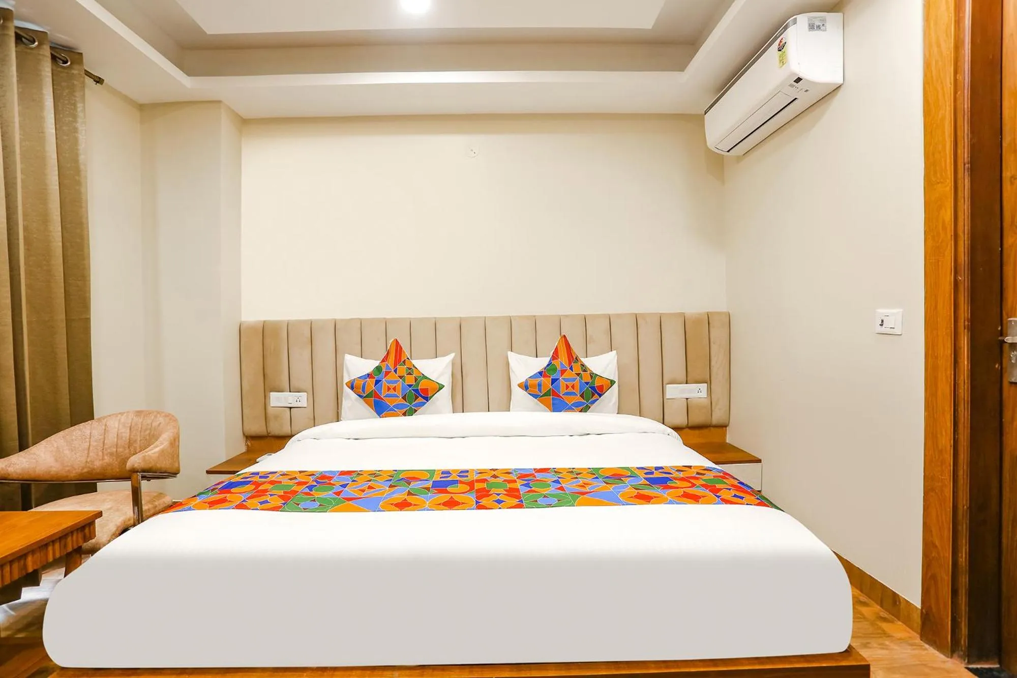 Bed in FabHotel Raahi Retreat - Nr Star Mall & 32nd Avenue