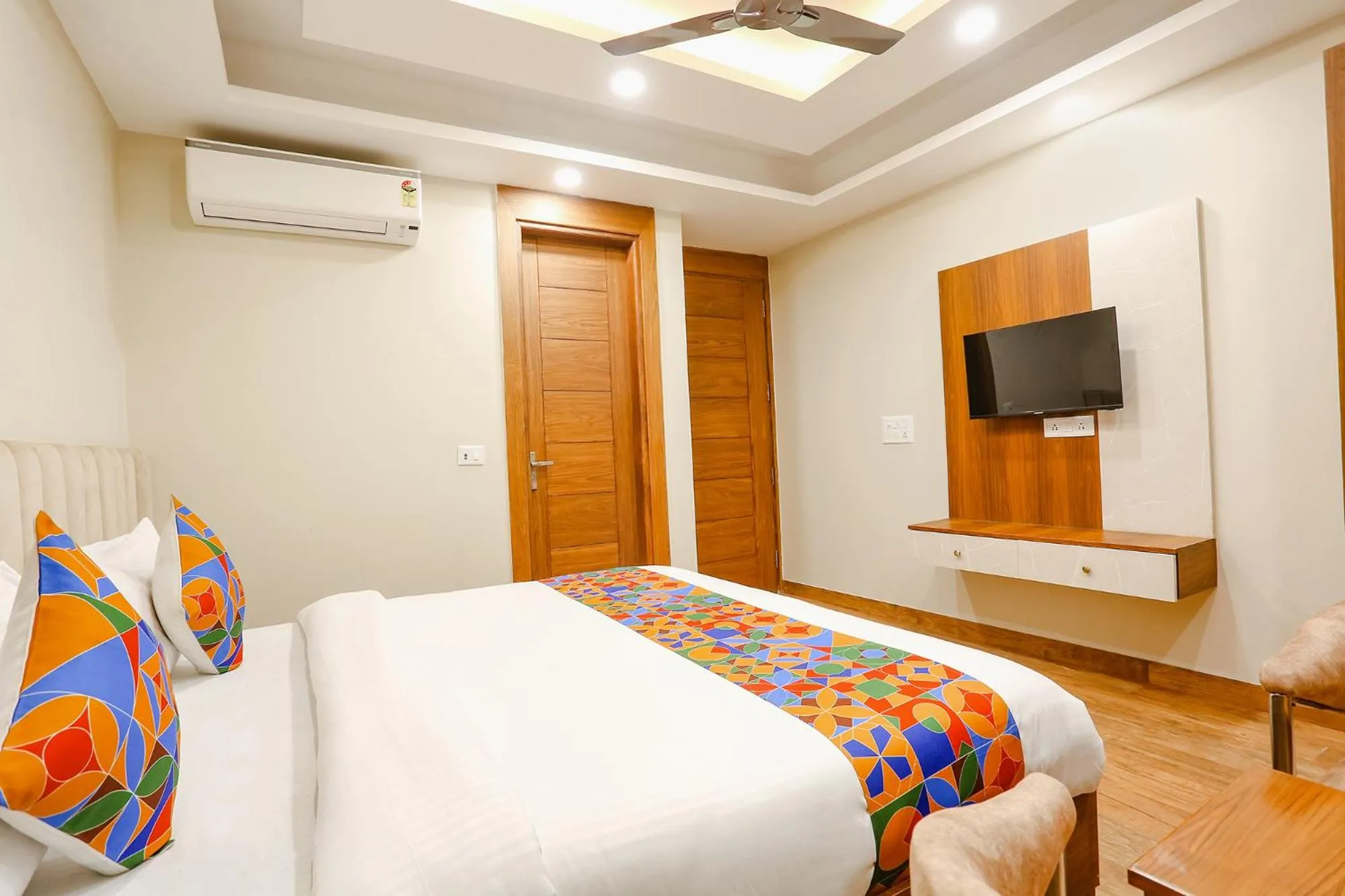 Communal lounge/ TV room, Bed in FabHotel Raahi Retreat - Nr Star Mall & 32nd Avenue