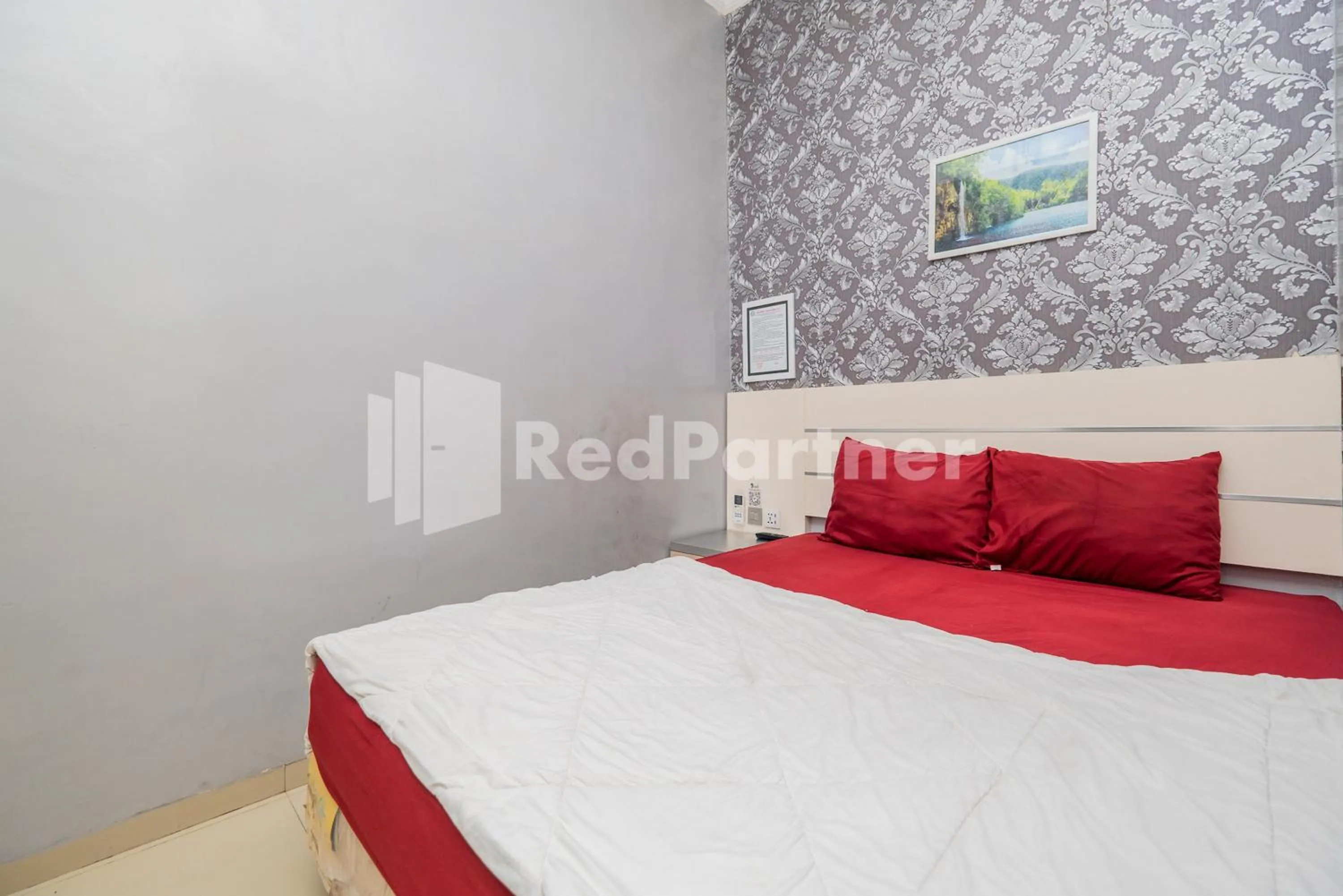 Bed in Omah Kalimosodo Mitra RedDoorz near Stasiun Malang Kota Baru