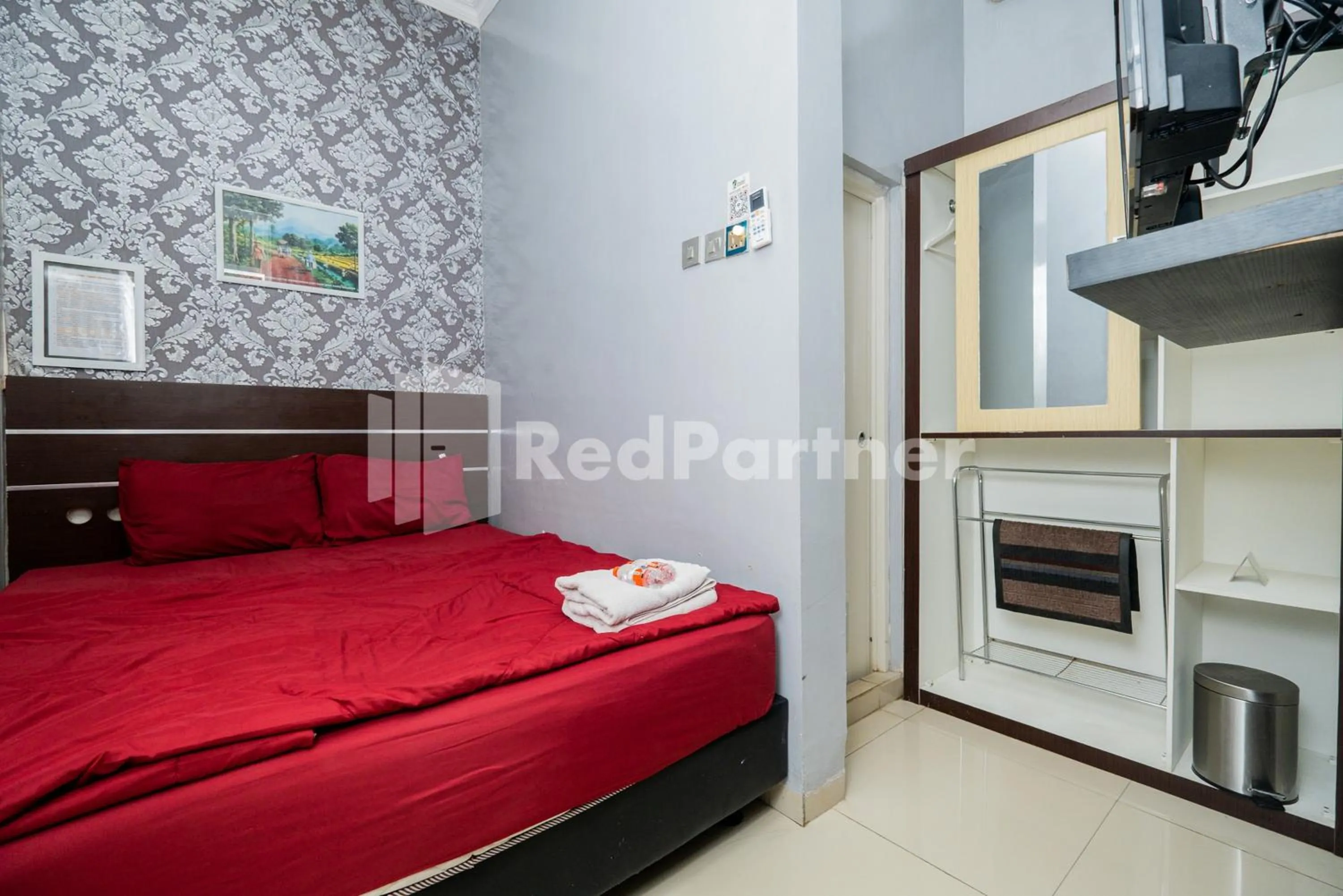 Bed in Omah Kalimosodo Mitra RedDoorz near Stasiun Malang Kota Baru