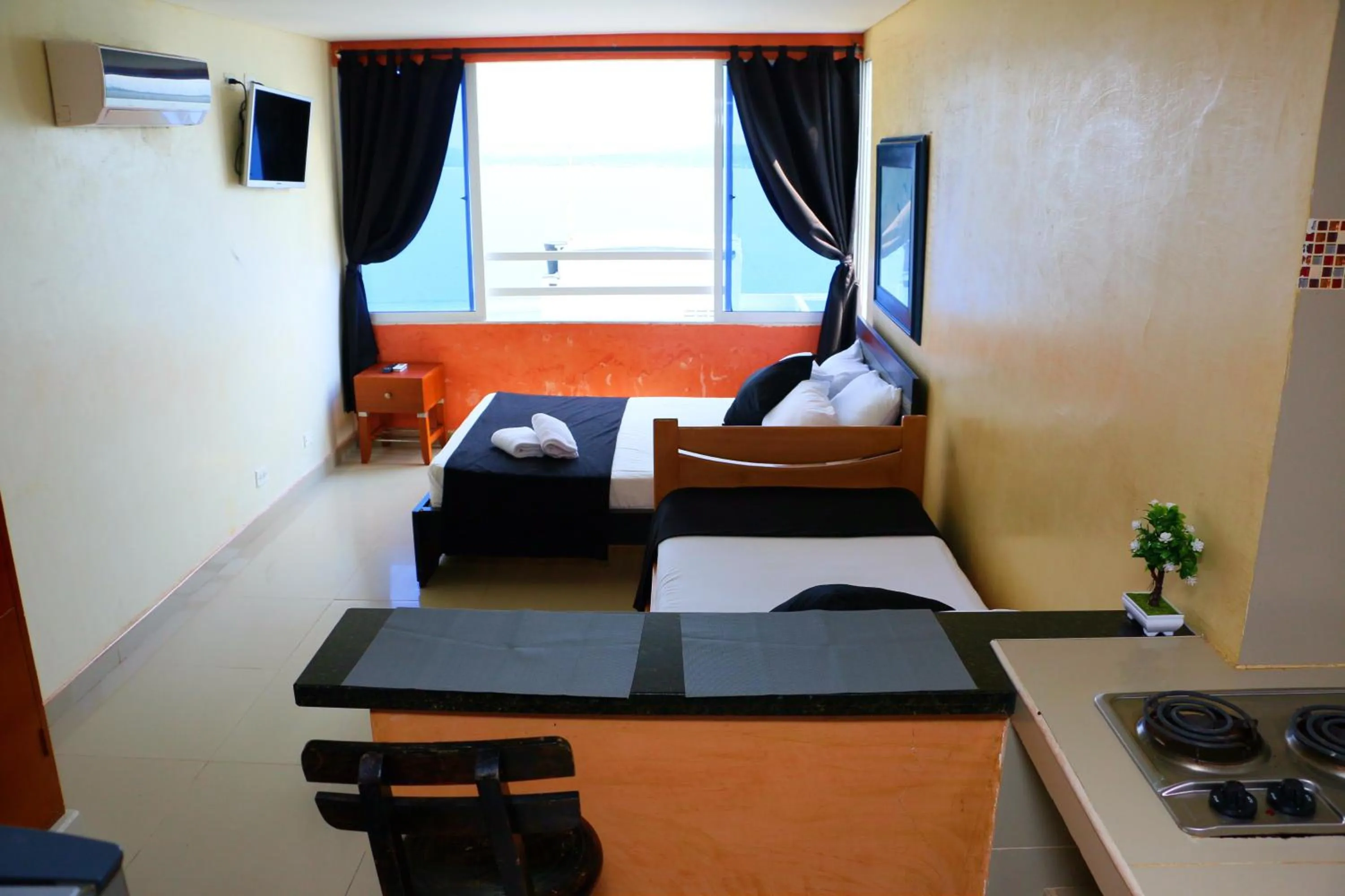 Kitchen or kitchenette, Bed in Studio Apartment E19C Close To The Sea And Pool